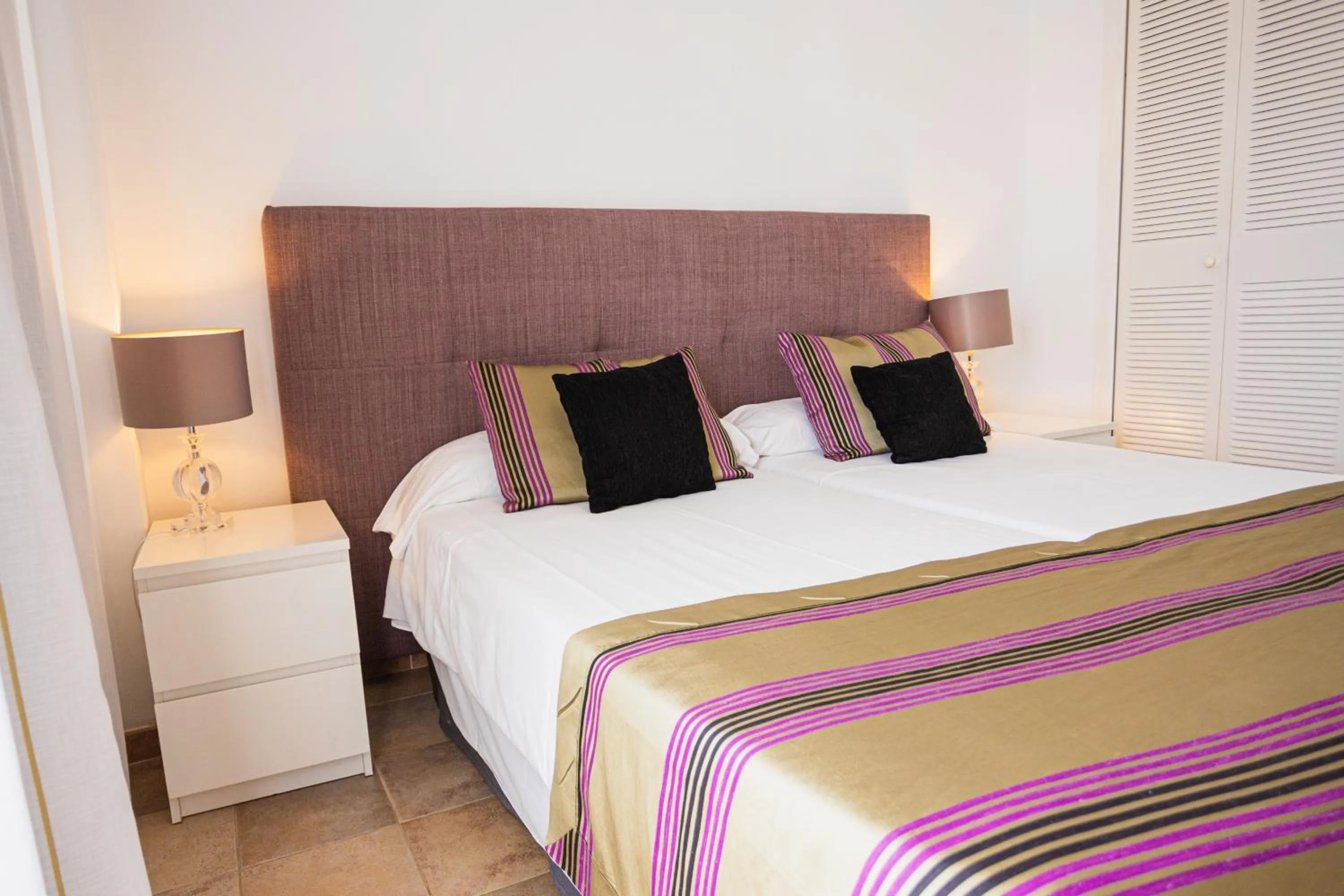 Bed in Lago Garden Apart-Suites & Spa Hotel