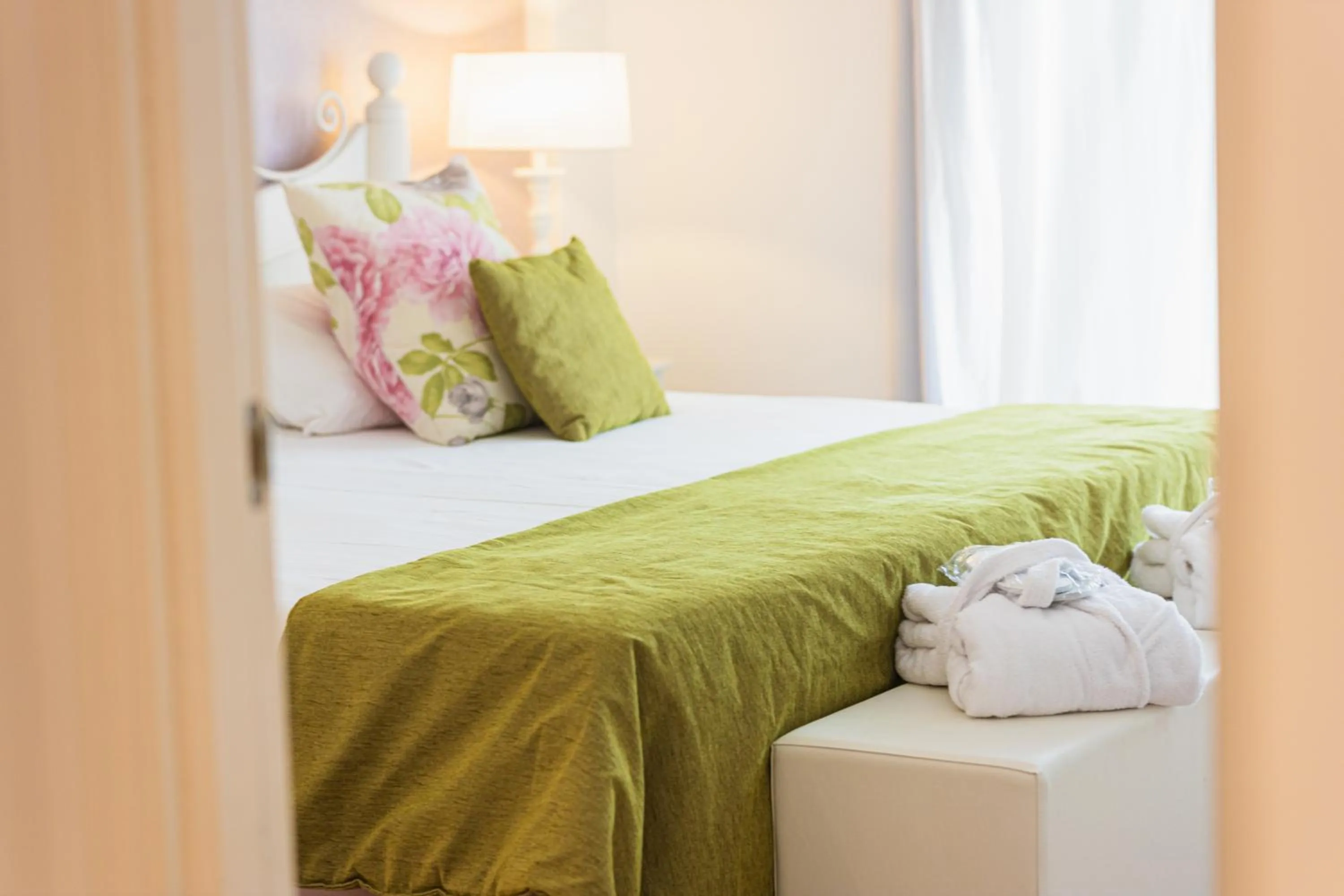 Bed in Lago Garden Apart-Suites & Spa Hotel