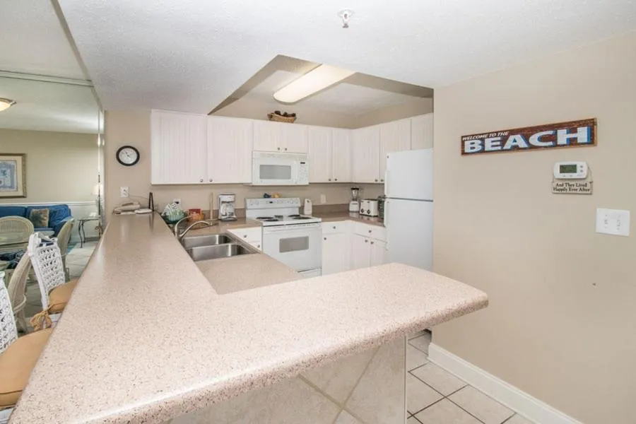 Kitchen or kitchenette in Pelican Beach 1504 by Pelican Beach Management