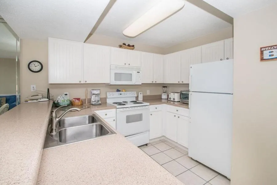 Kitchen or kitchenette in Pelican Beach 1504 by Pelican Beach Management