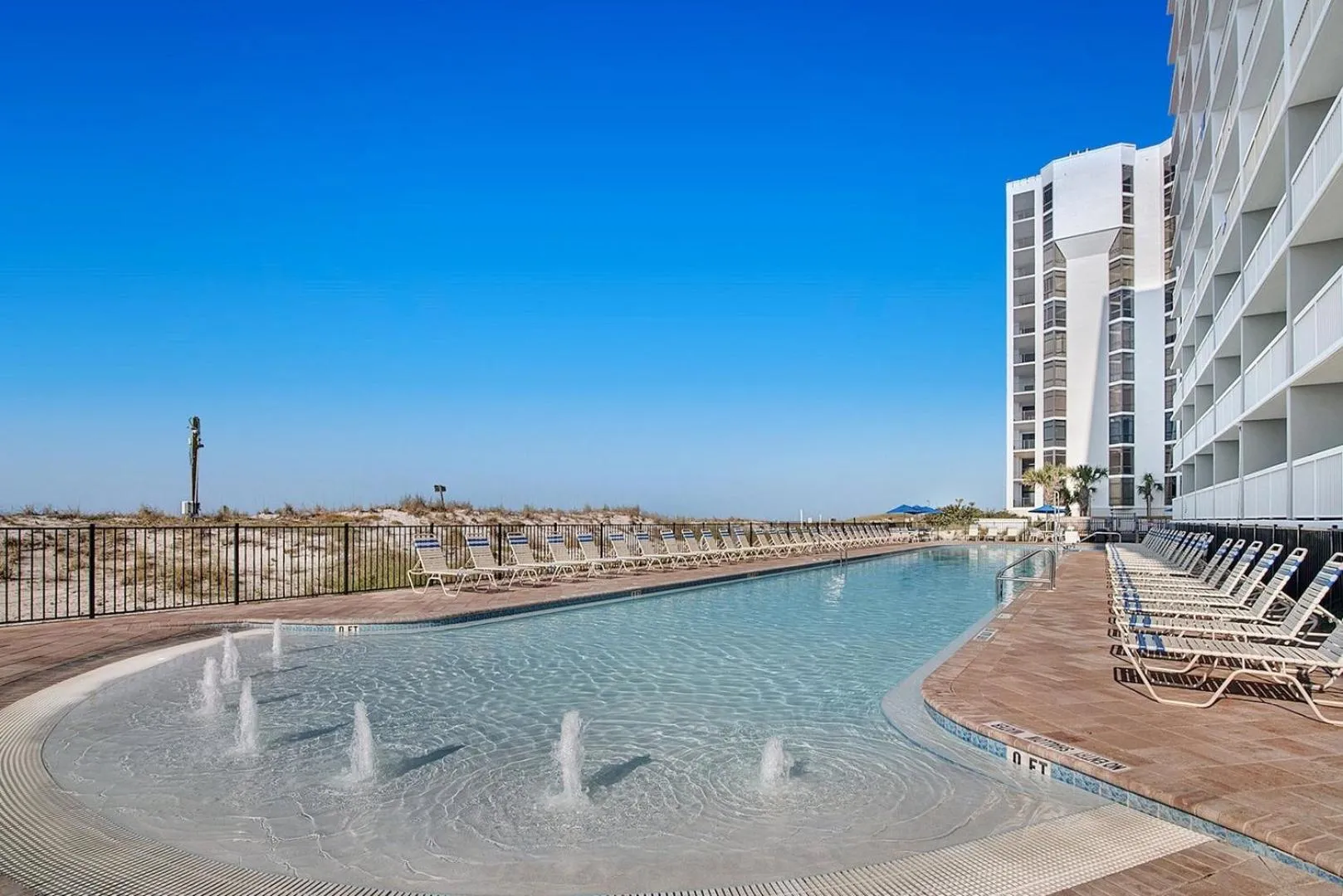 Swimming pool in Pelican Beach 1504 by Pelican Beach Management