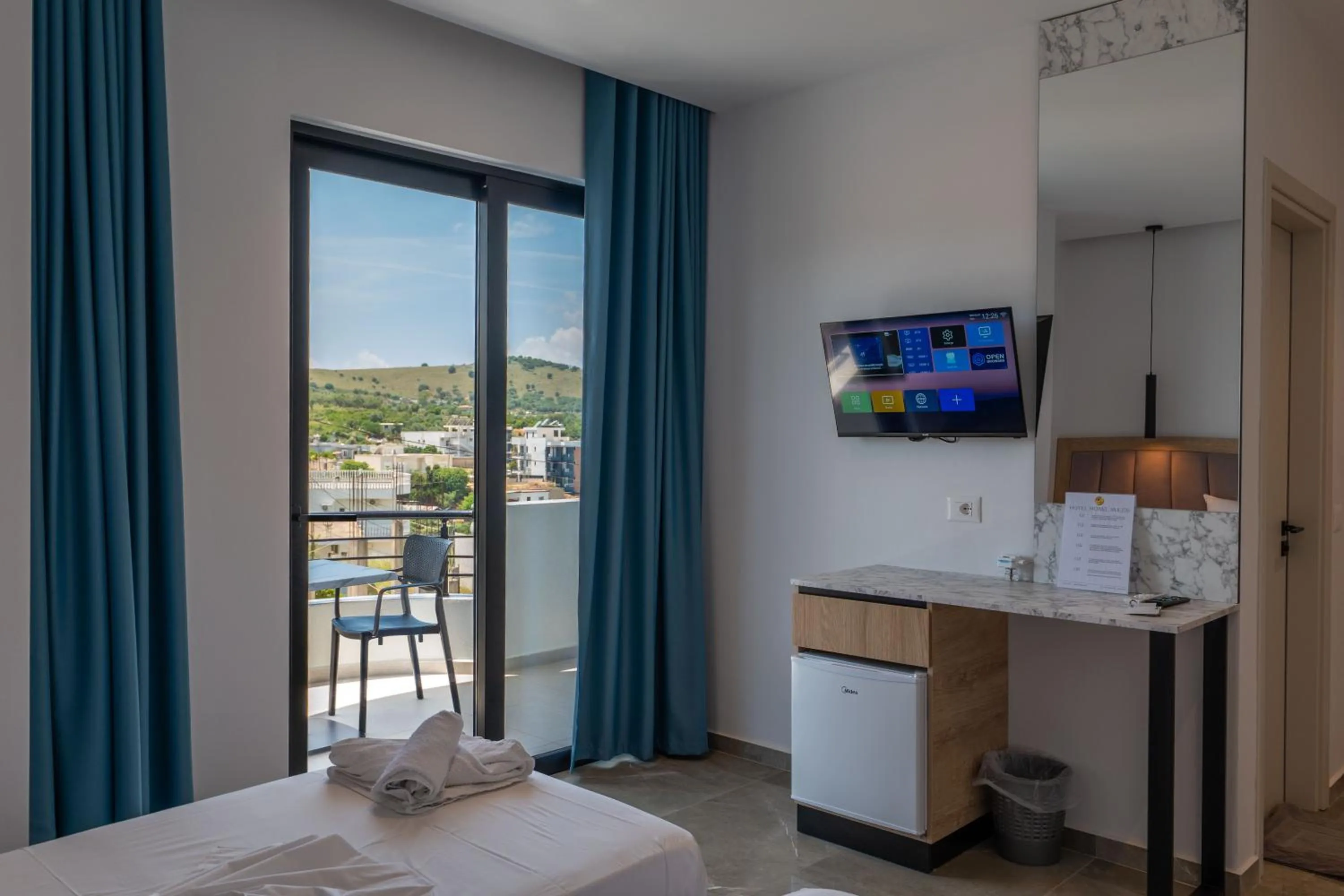 View (from property/room), Bed in Monel Hotel