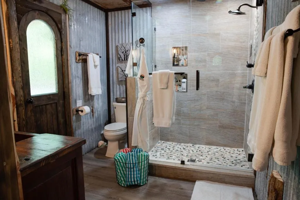 Hobbit Treehouse with waterfall on the Brazos River! 350 acres! Tubing! Petting zoo!