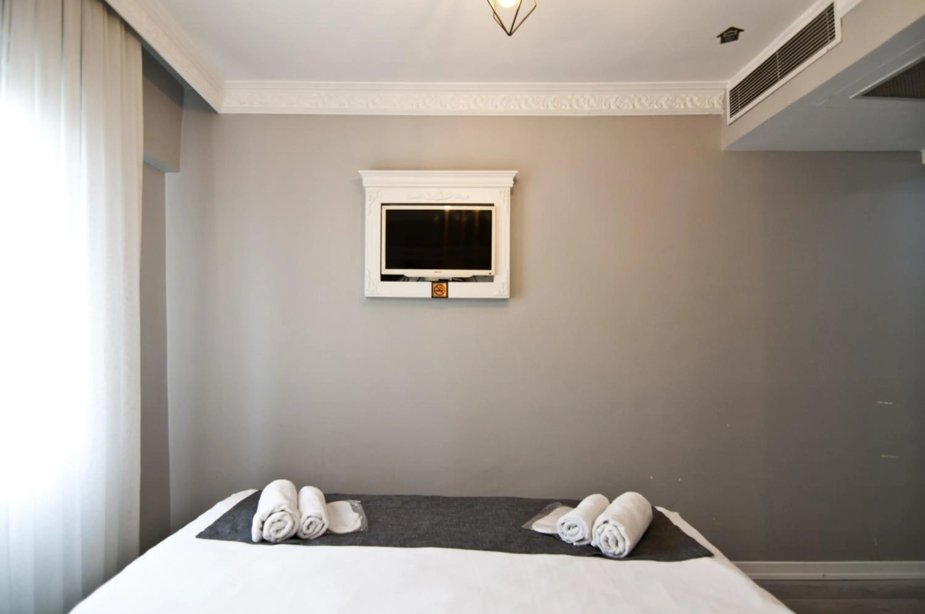 Bed in Nova City Hotel