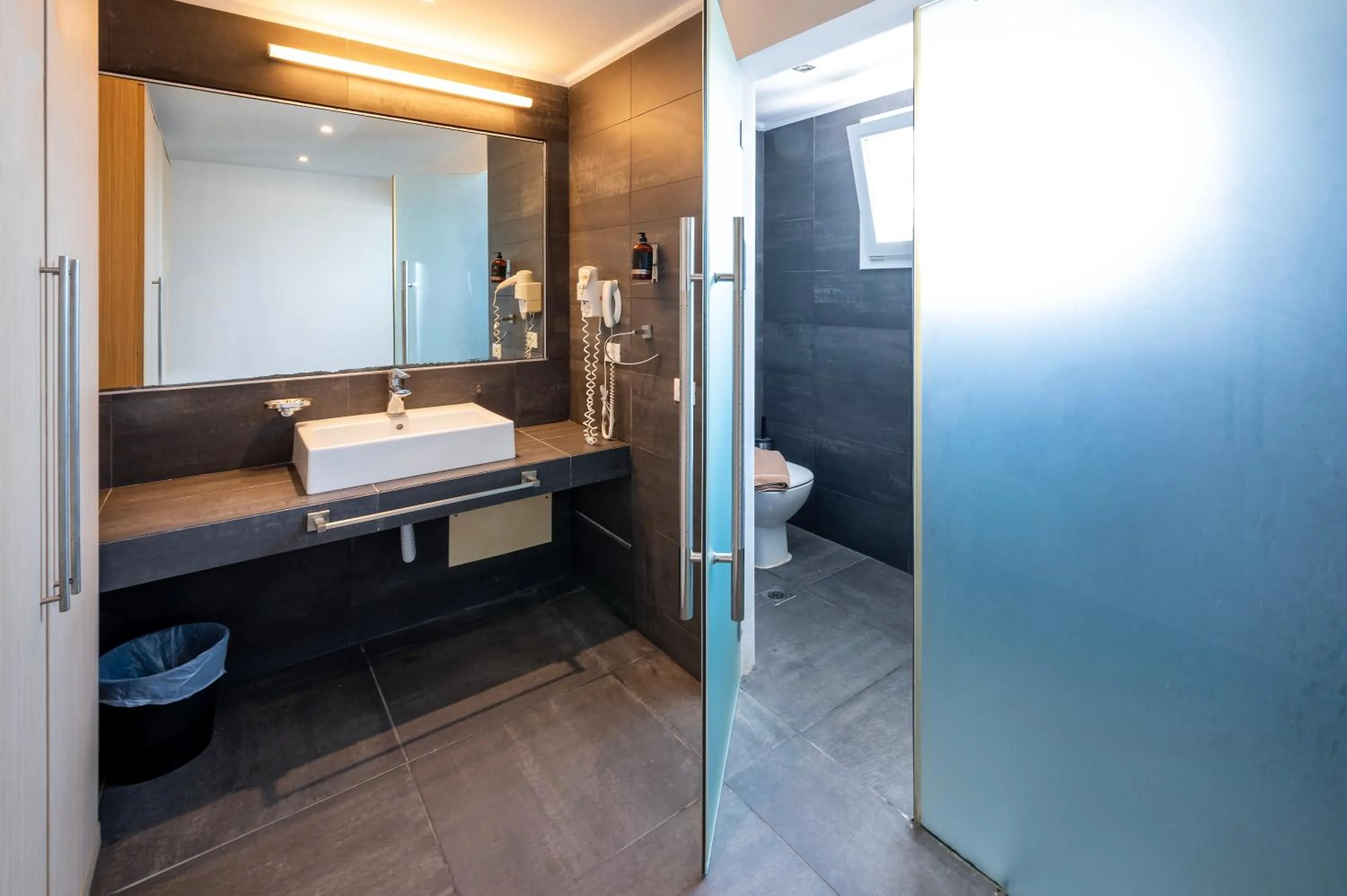 Bathroom in Orizontes Hotel Santorini