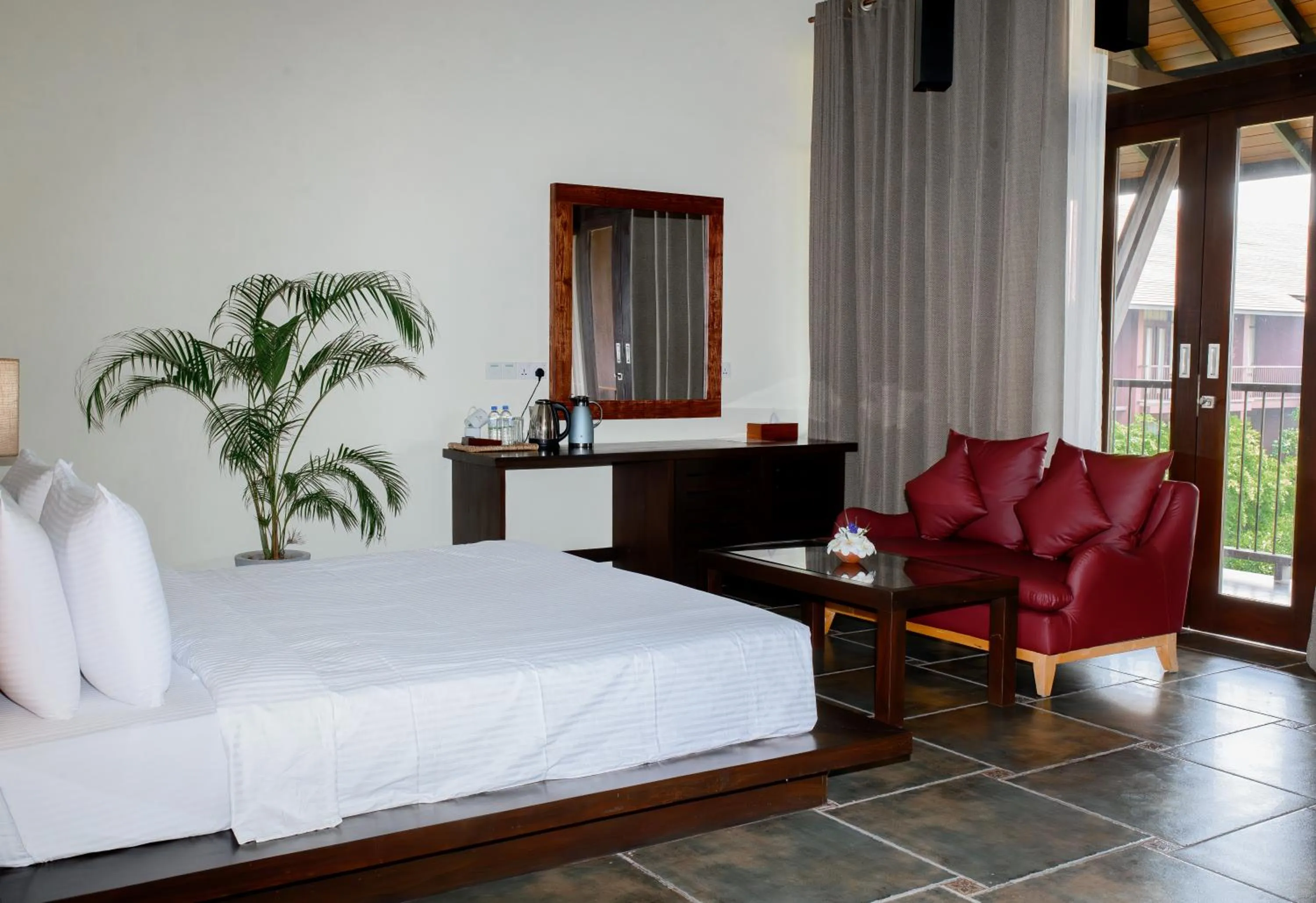 Bed in Celestia Ayurveda Resort