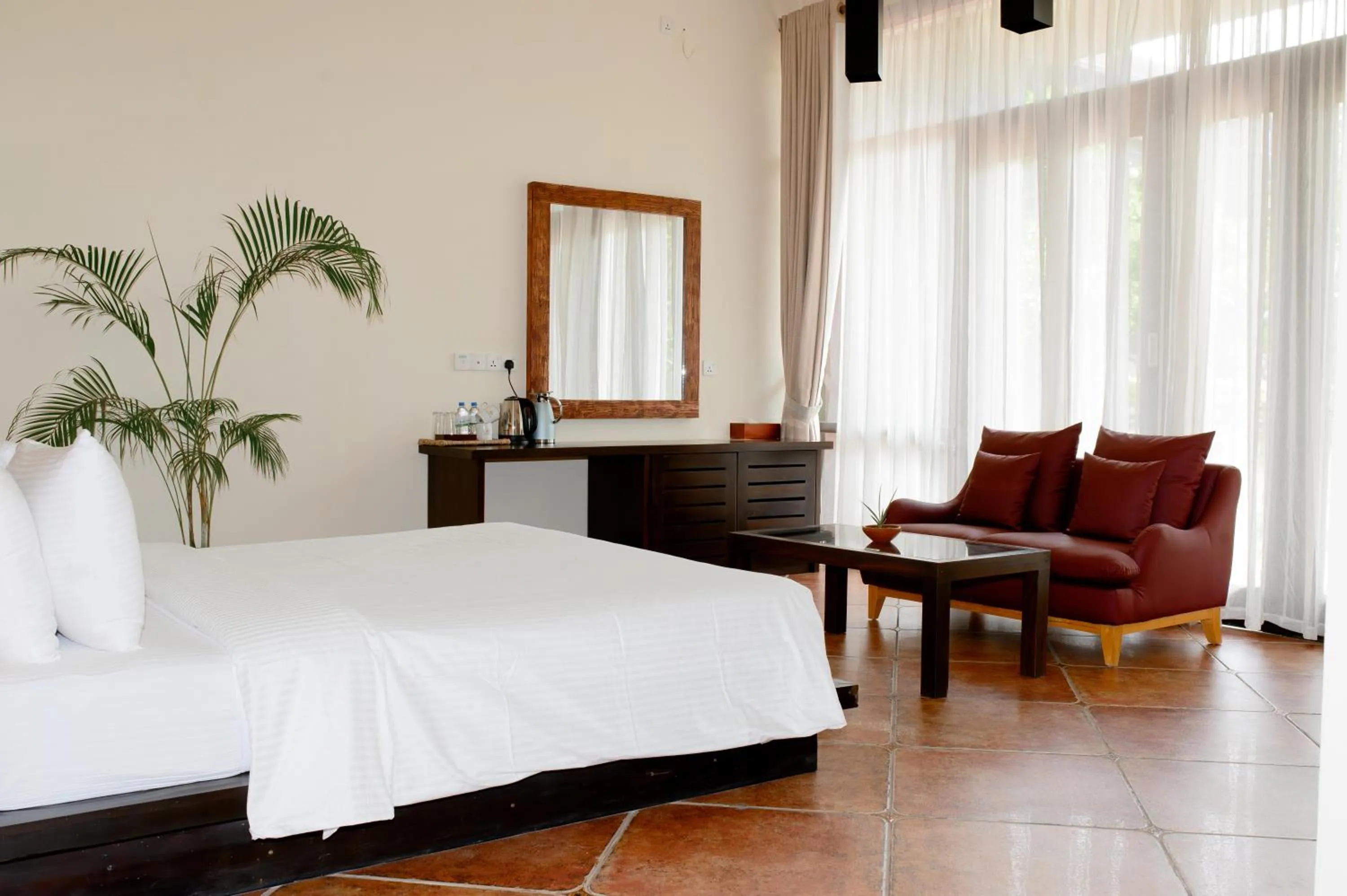 Bed in Celestia Ayurveda Resort