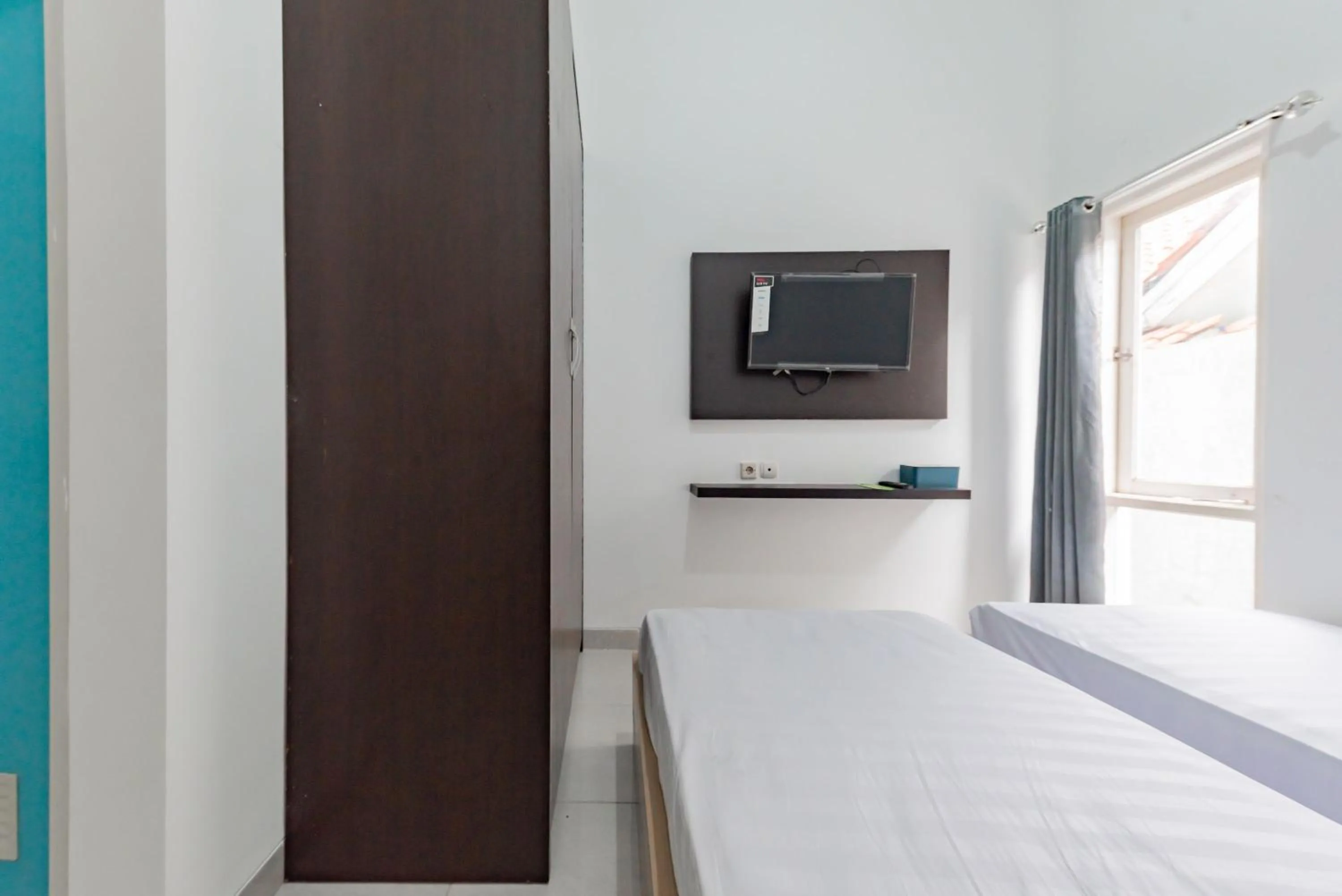 Bedroom, Bed in Urbanview Hotel Sabar Residence CSB Mall