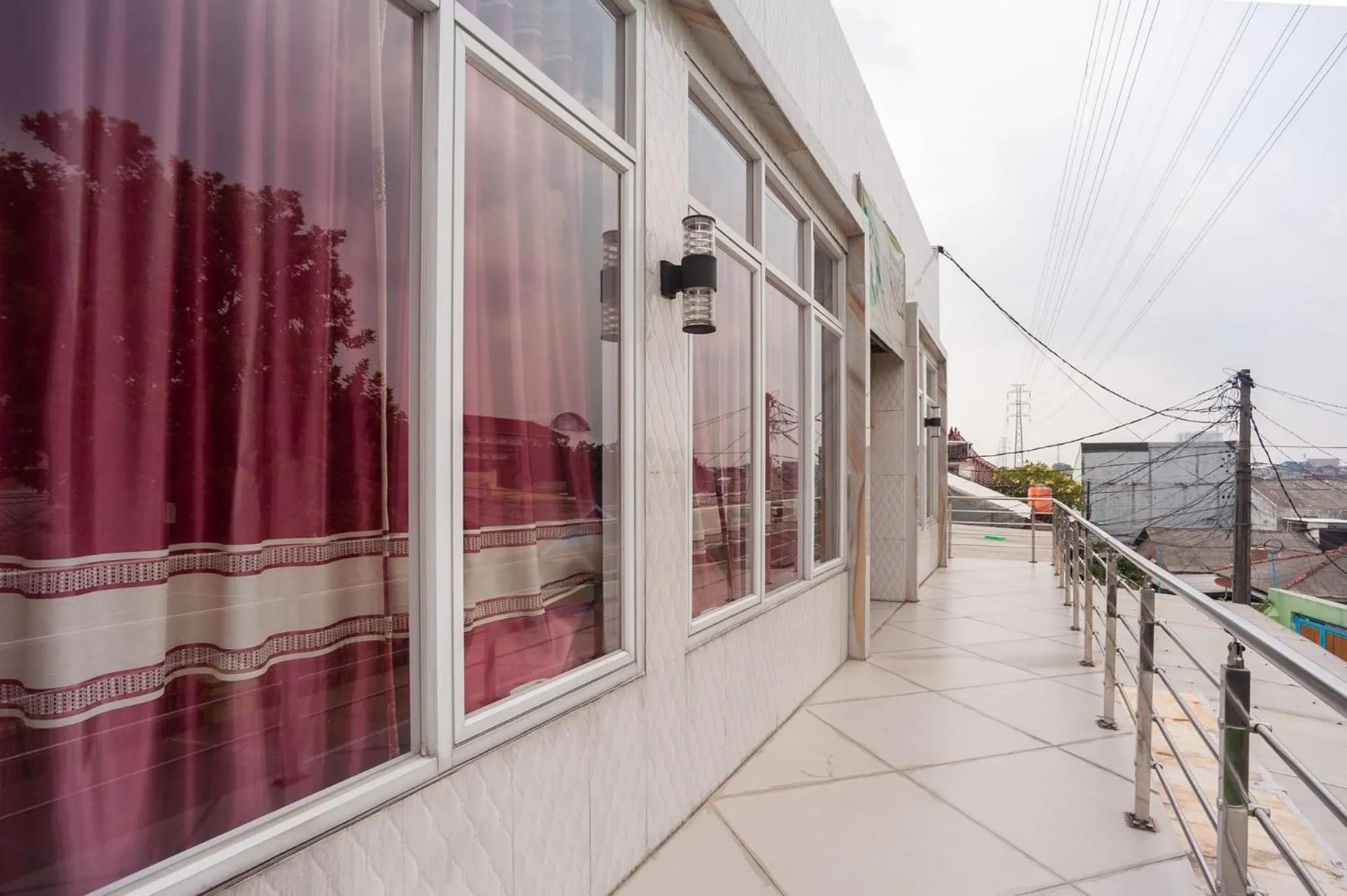 Property building in Urbanview My Home Ciracas by RedDoorz