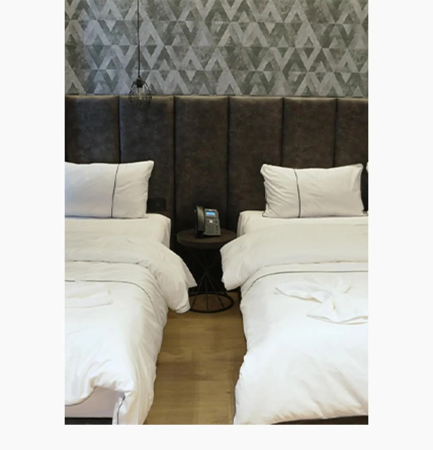 Bed in StarLight Hotel