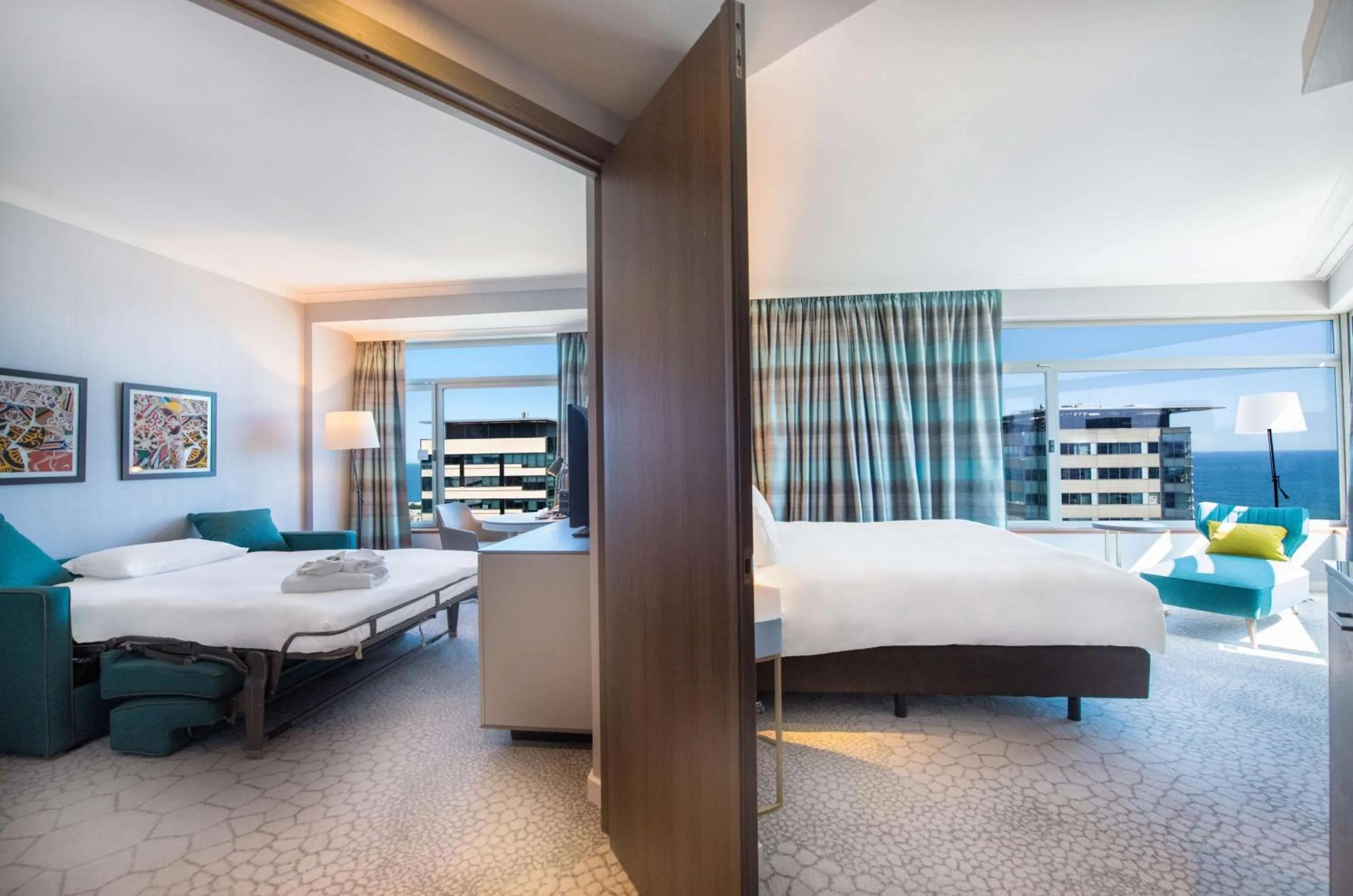 Living room, Bed in Hilton Diagonal Mar Barcelona