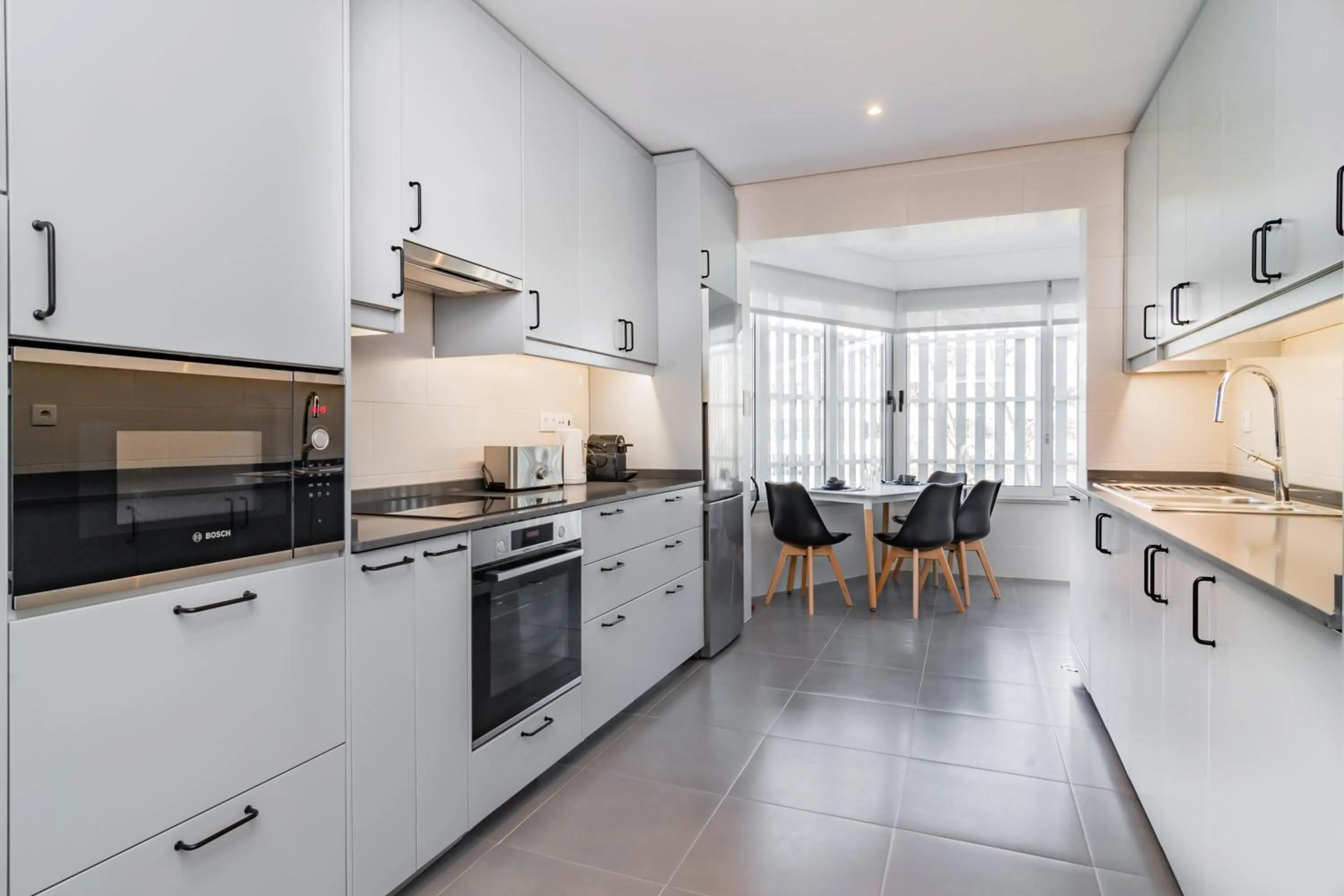 Kitchen or kitchenette in Coastal Charm by LovelyStay