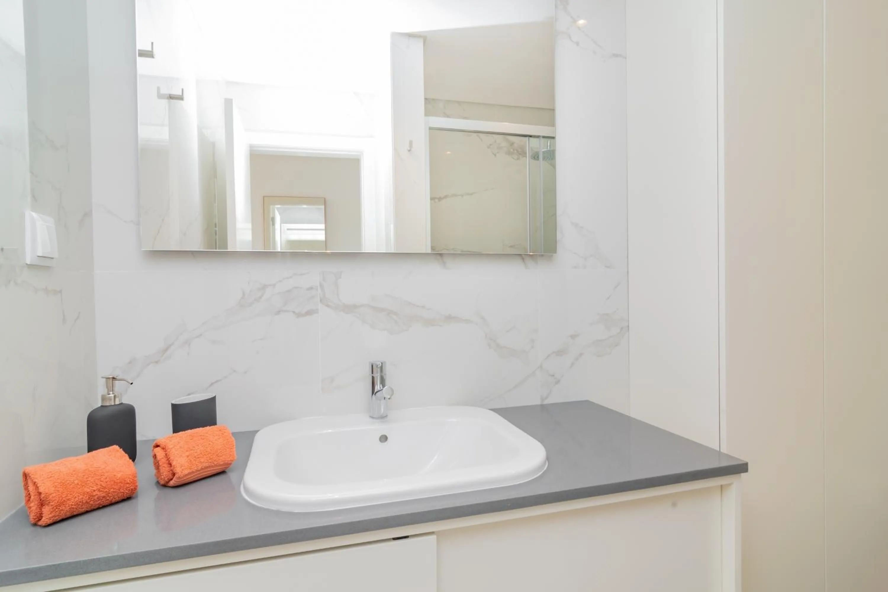 Bathroom in Coastal Charm by LovelyStay