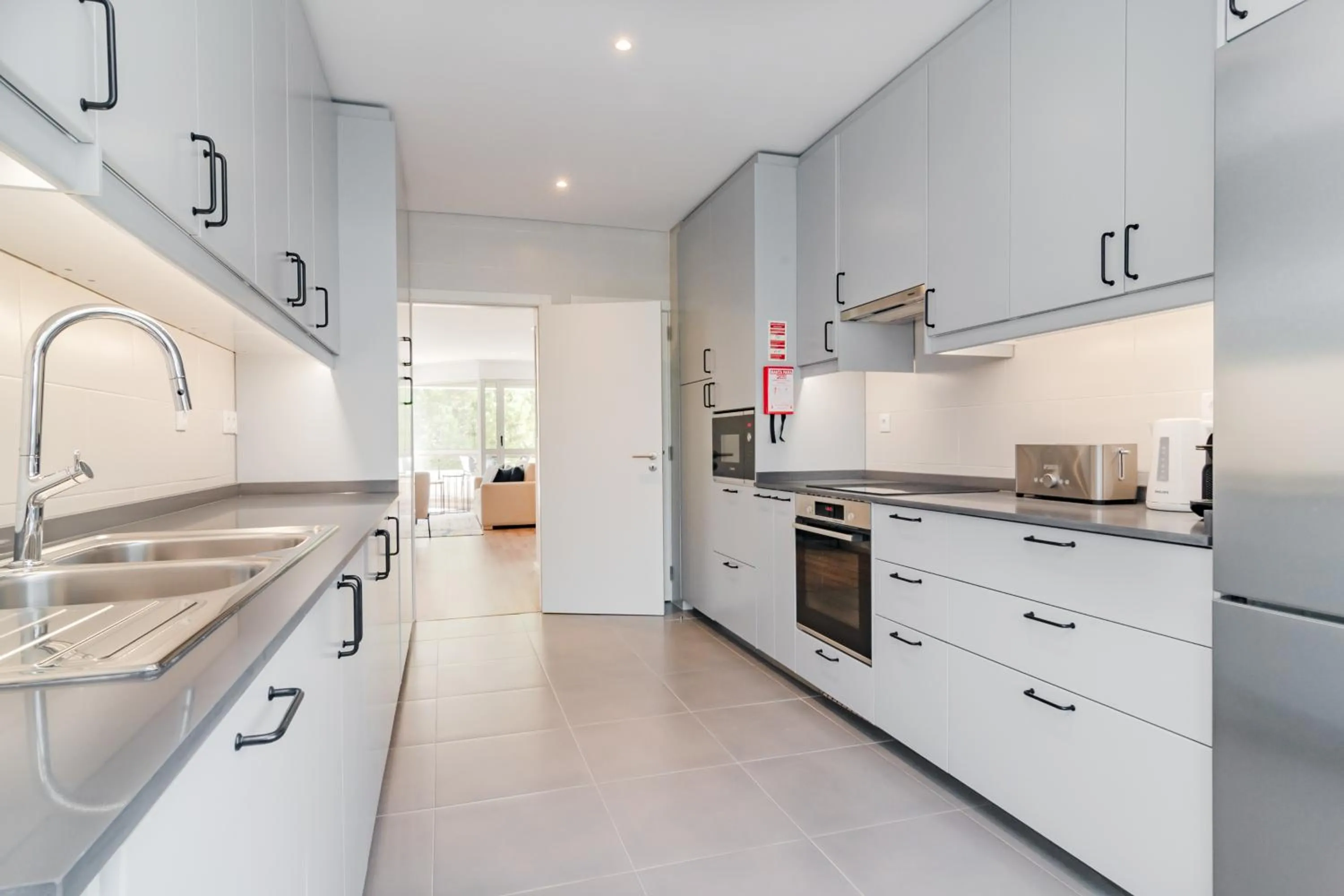 Kitchen or kitchenette in Coastal Charm by LovelyStay