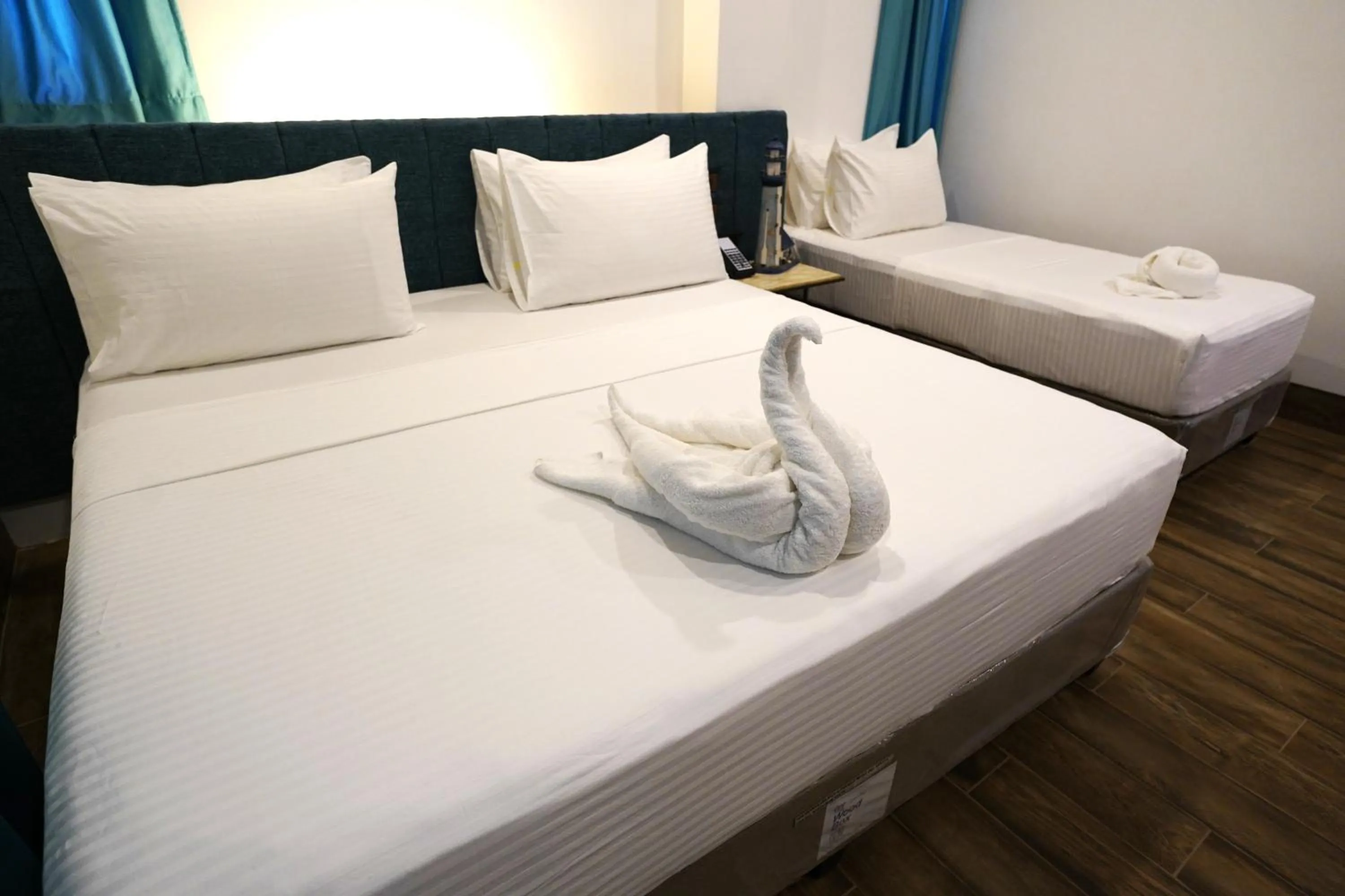 Bed in Lighthouse Point Hotel