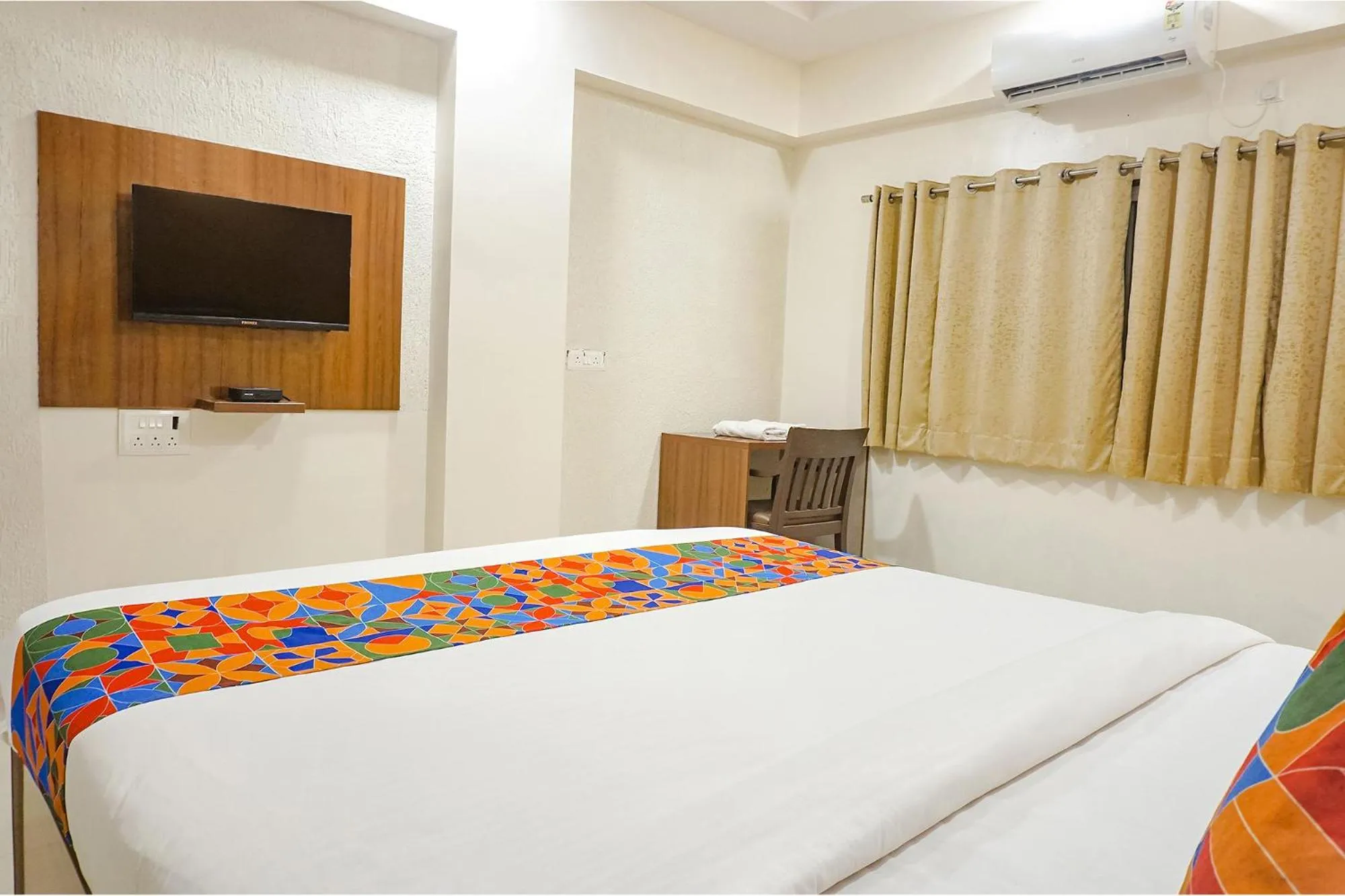 Bed in FabHotel Embassy near Amanora Mall