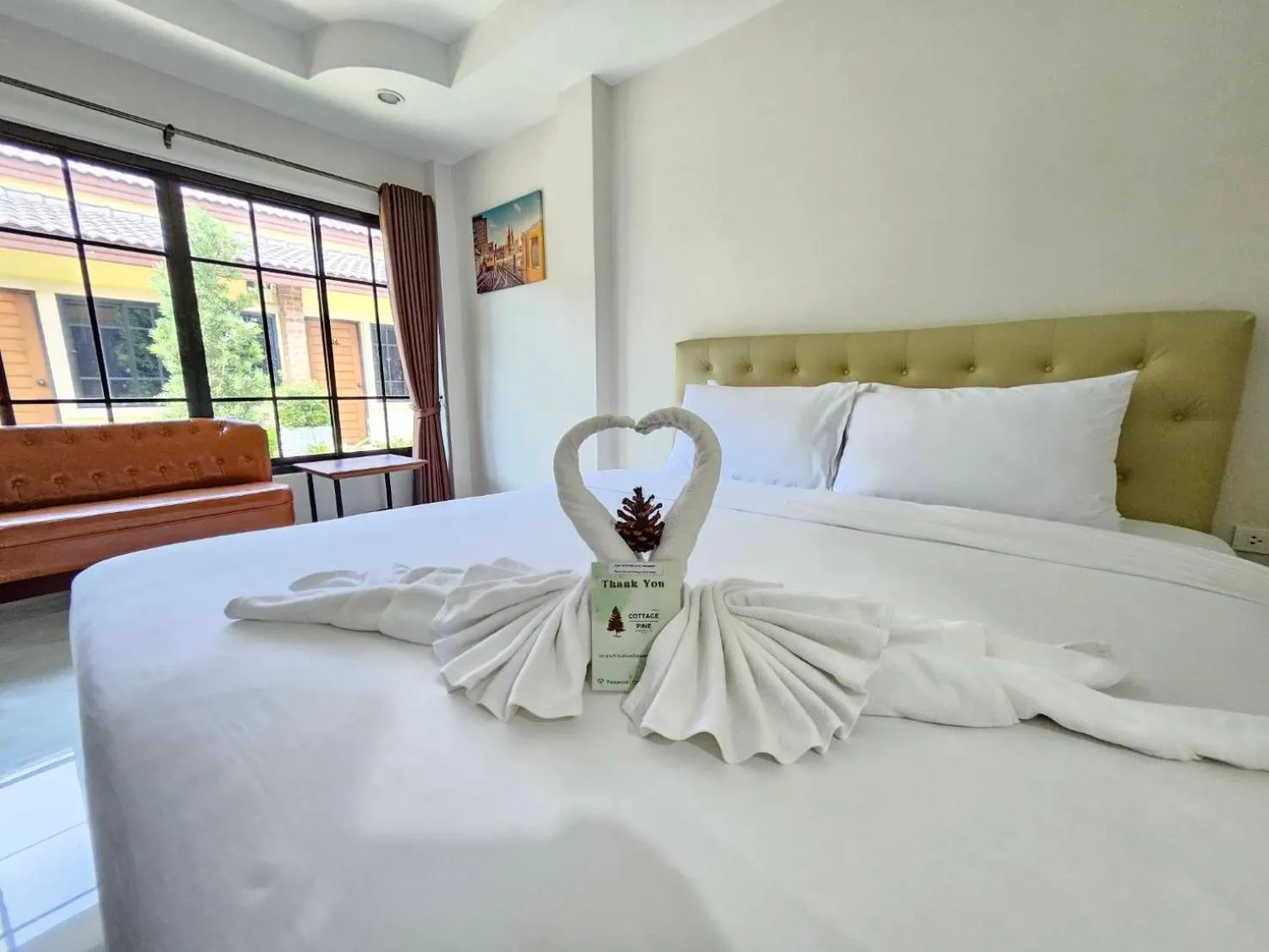 Bed in CottagePine Rayong Resort&Cafe