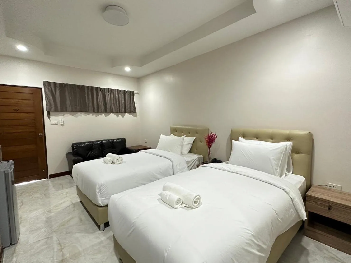 Bed in CottagePine Rayong Resort&Cafe