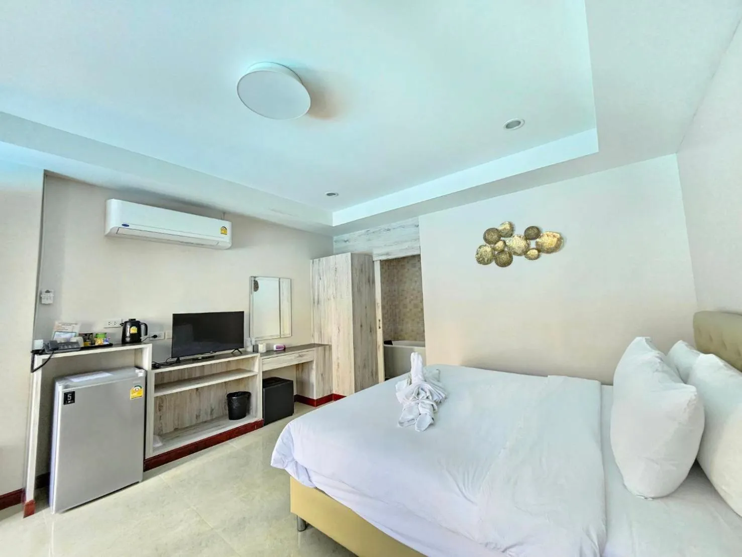 Bed in CottagePine Rayong Resort&Cafe