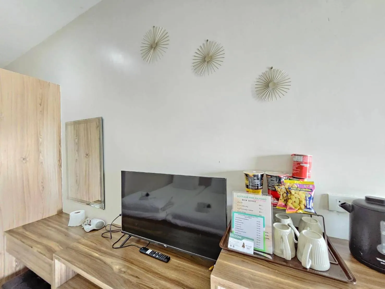 TV and multimedia in CottagePine Rayong Resort&Cafe