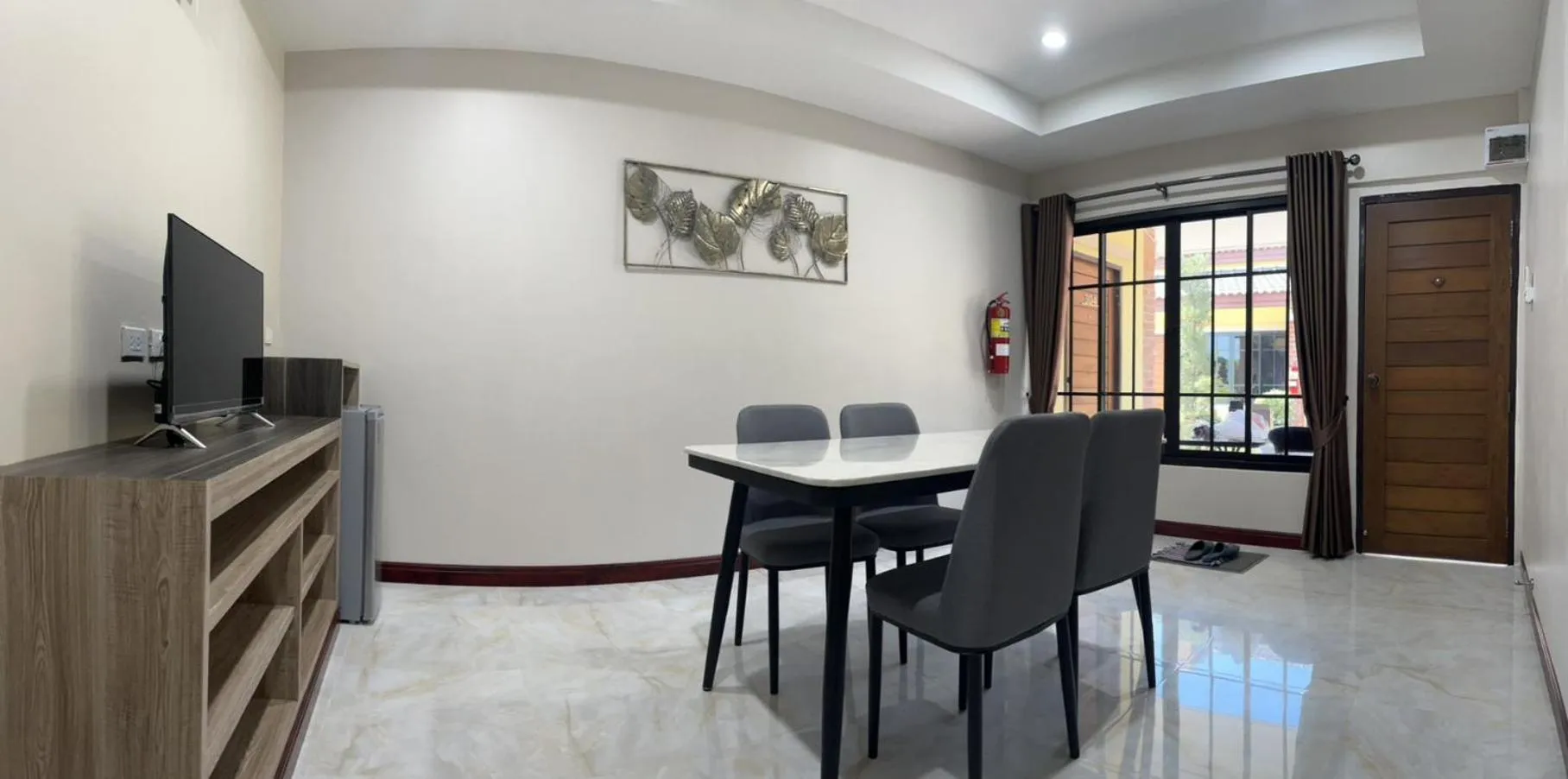 TV and multimedia in CottagePine Rayong Resort&Cafe