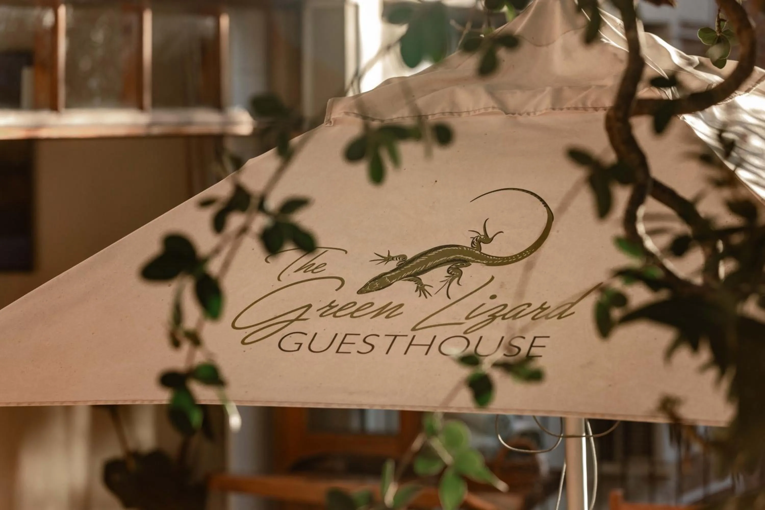 Property logo or sign in The Green Lizard Guesthouse