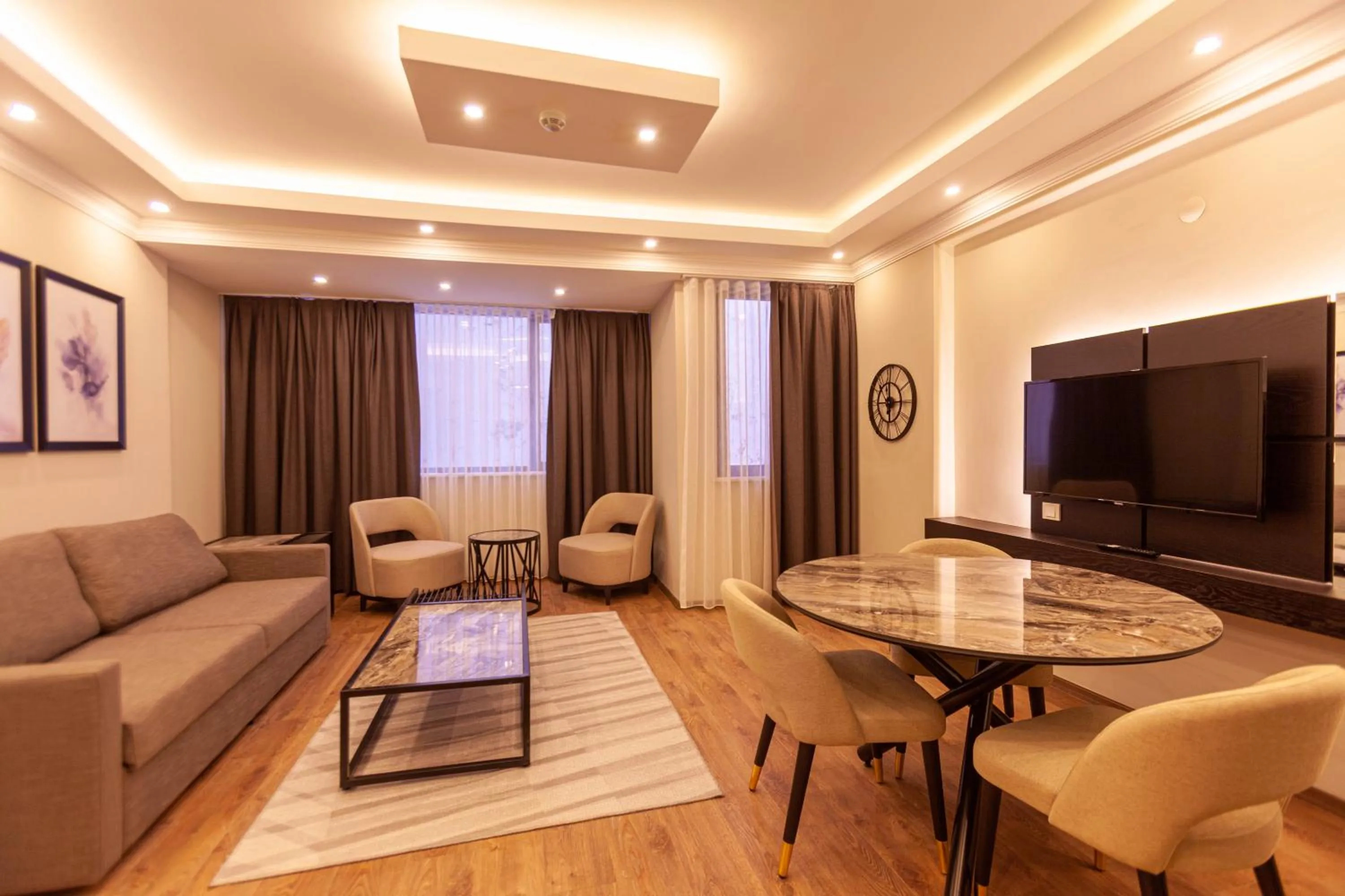 Communal lounge/ TV room in Lilium Luxury Suites