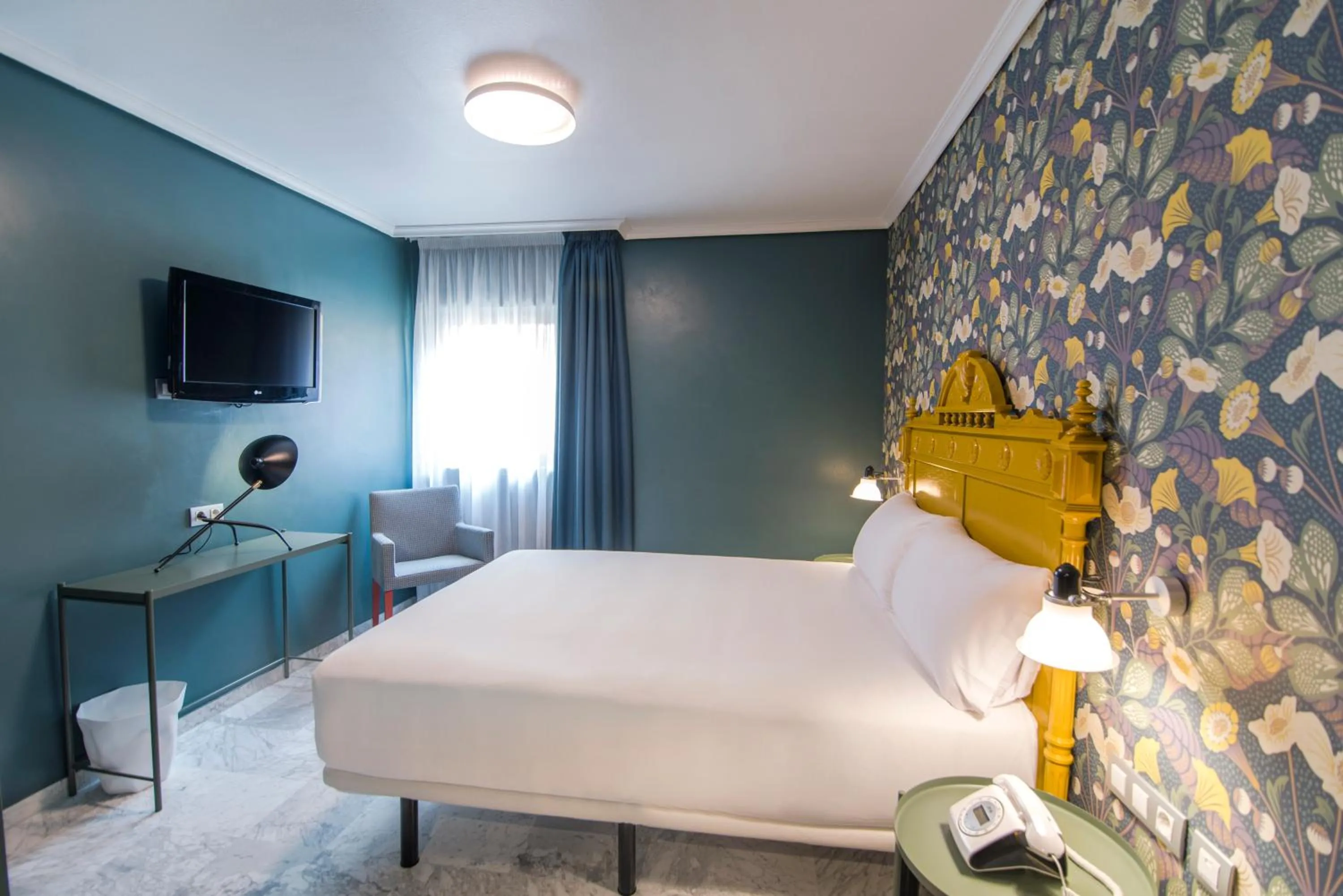 Bed in Petit Palace Puerta de Triana