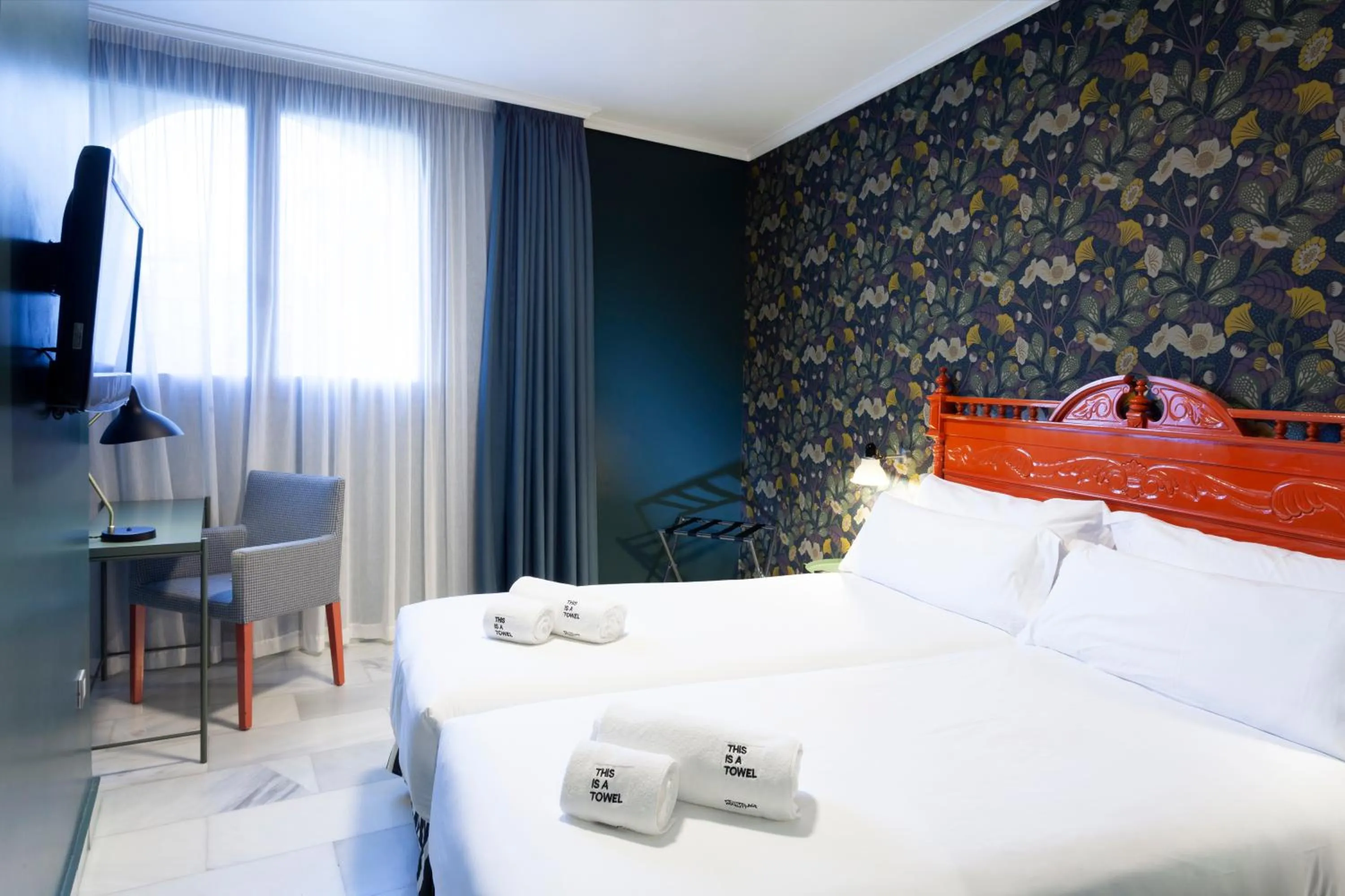 Bed in Petit Palace Puerta de Triana