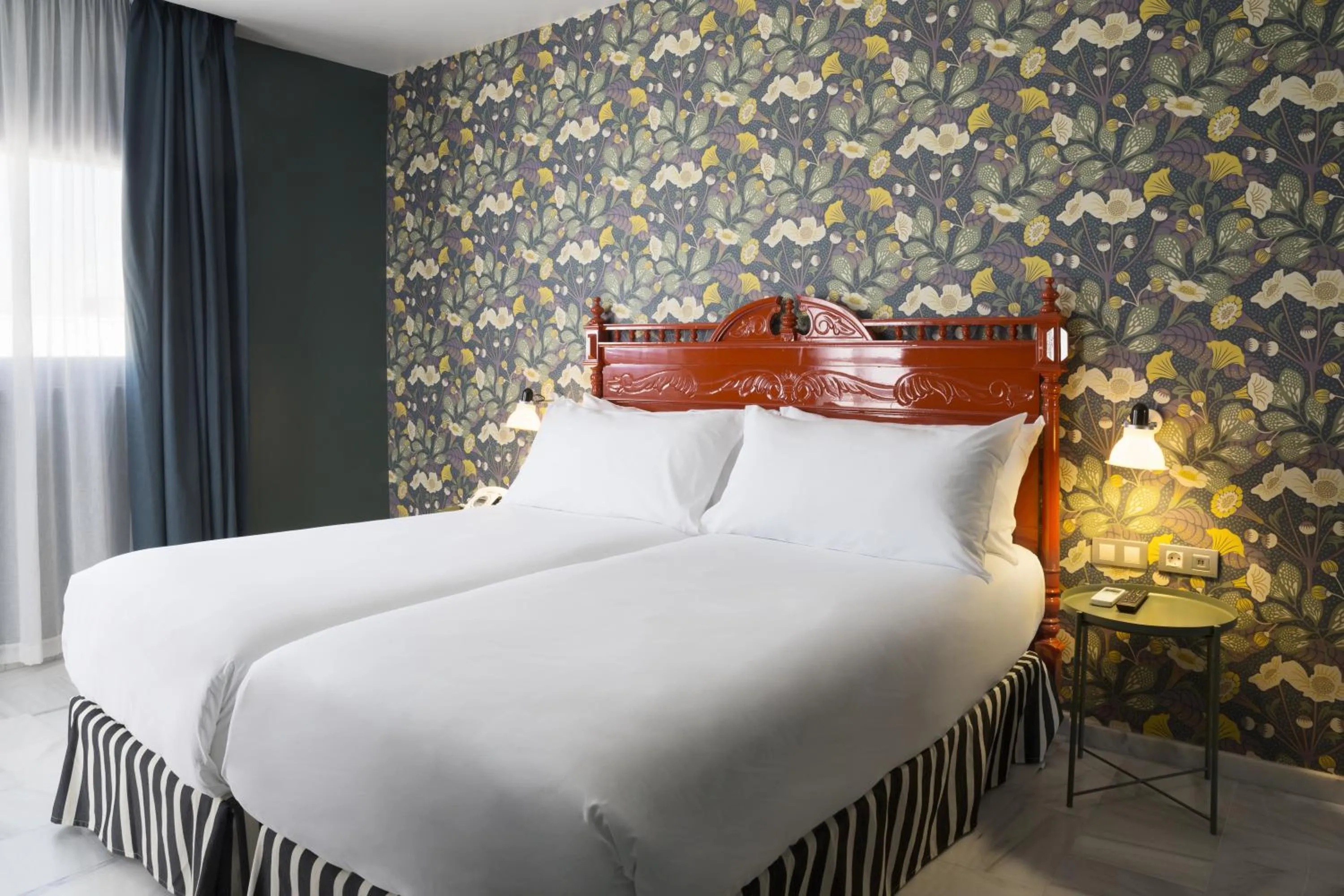 Bed in Petit Palace Puerta de Triana