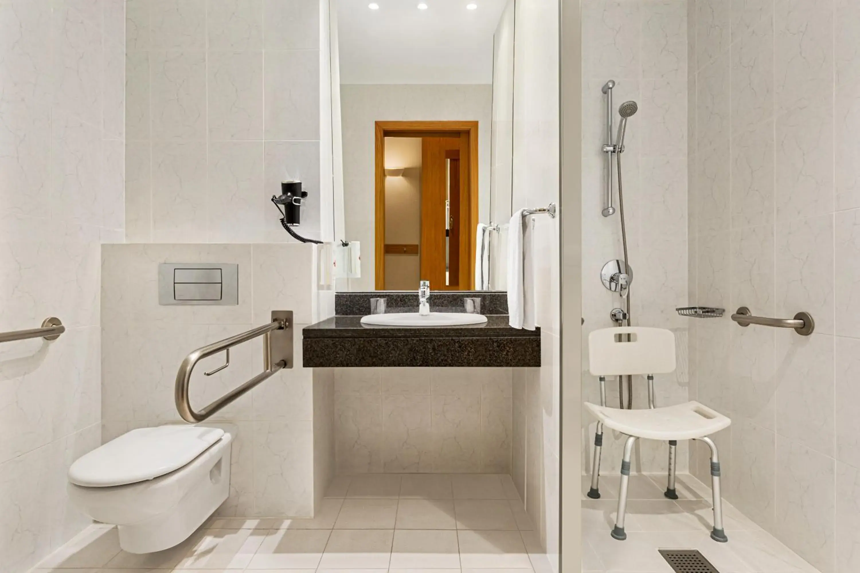 Toilet, Bathroom in Ramada by Wyndham Madrid Tres Cantos