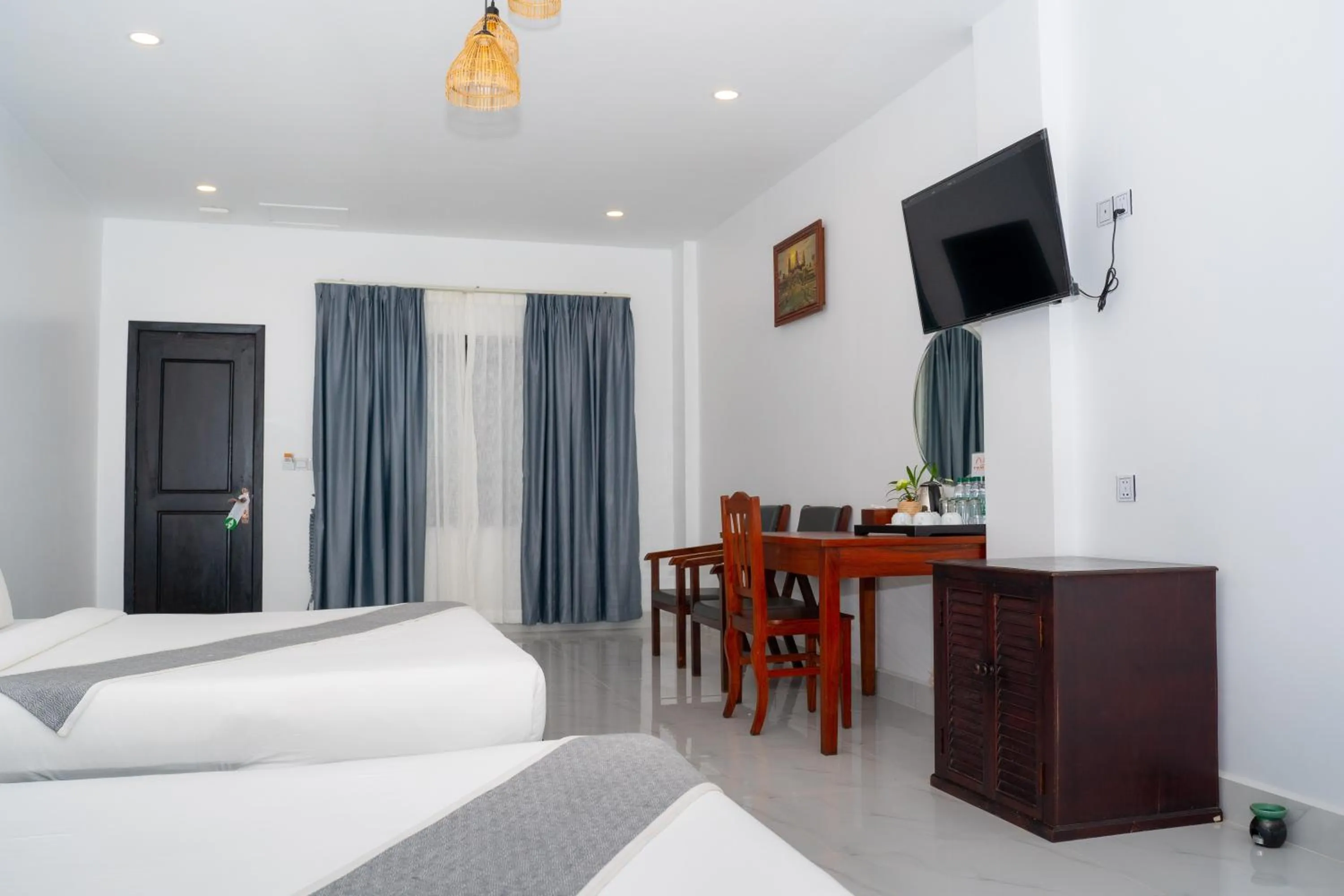 Photo of the whole room, Bed in Angkor Tempora Boutique