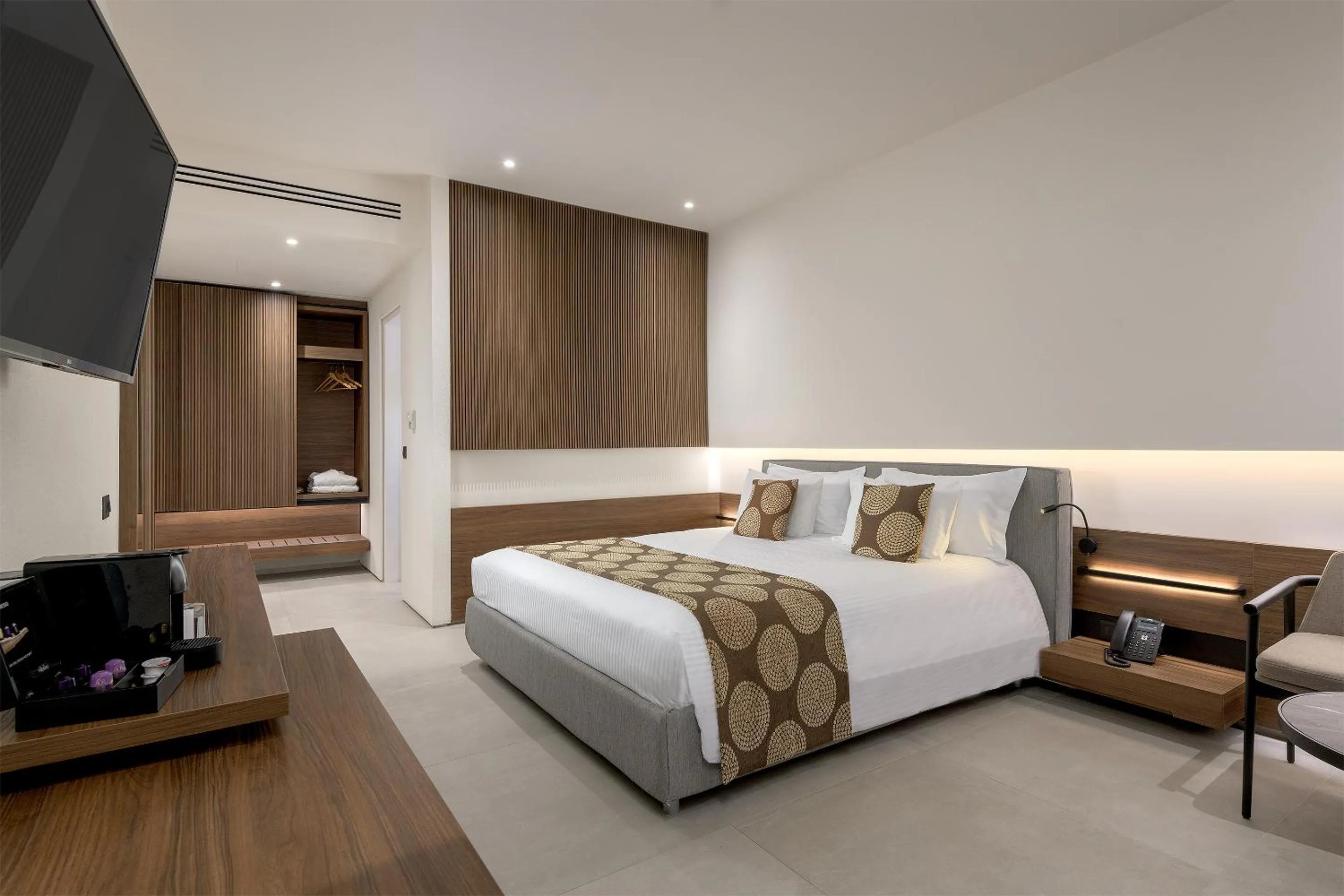 Bed in The Ixian Grand & All Suites - Adults Only Hotel