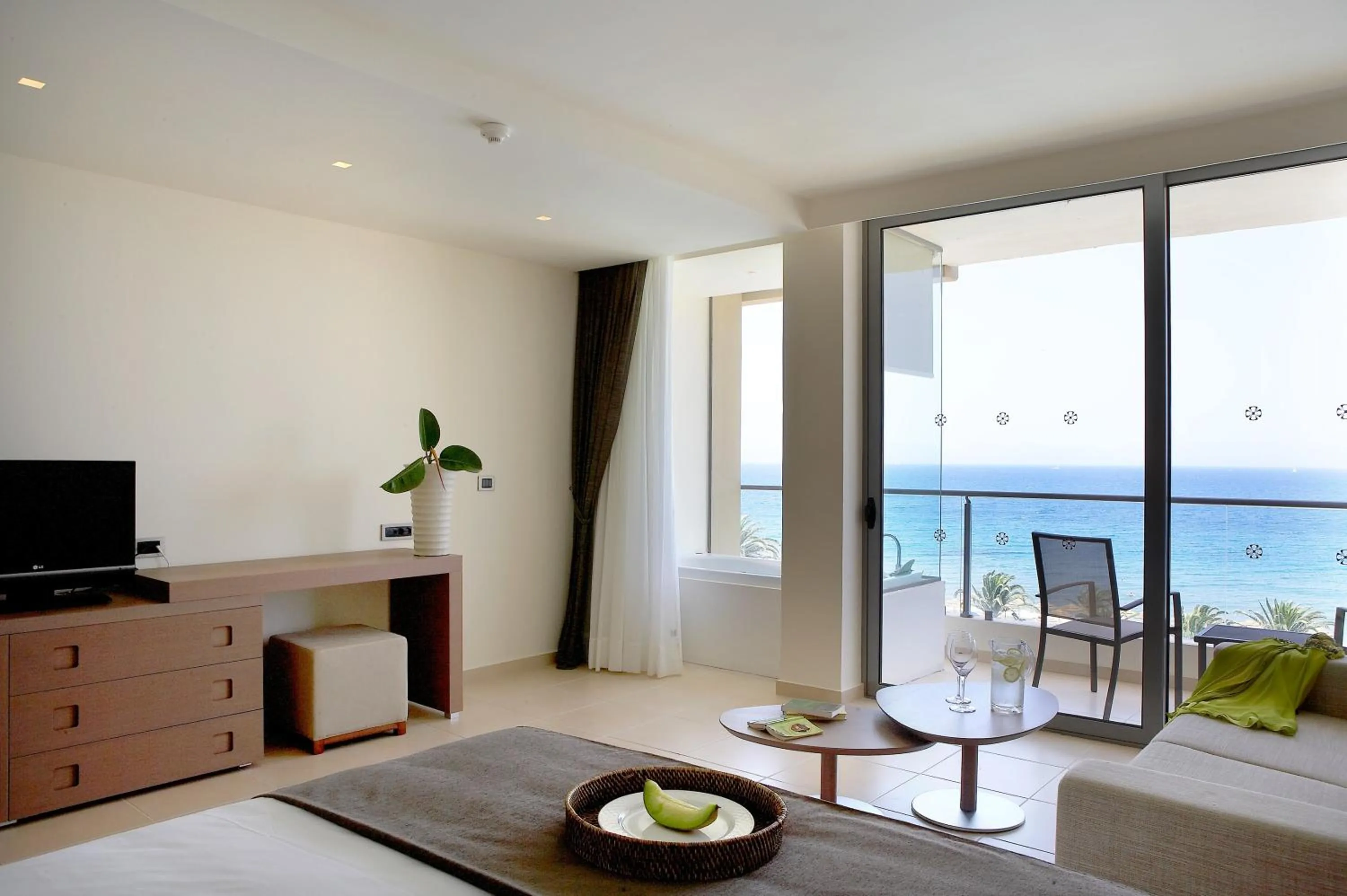 Bed in The Ixian Grand & All Suites - Adults Only Hotel