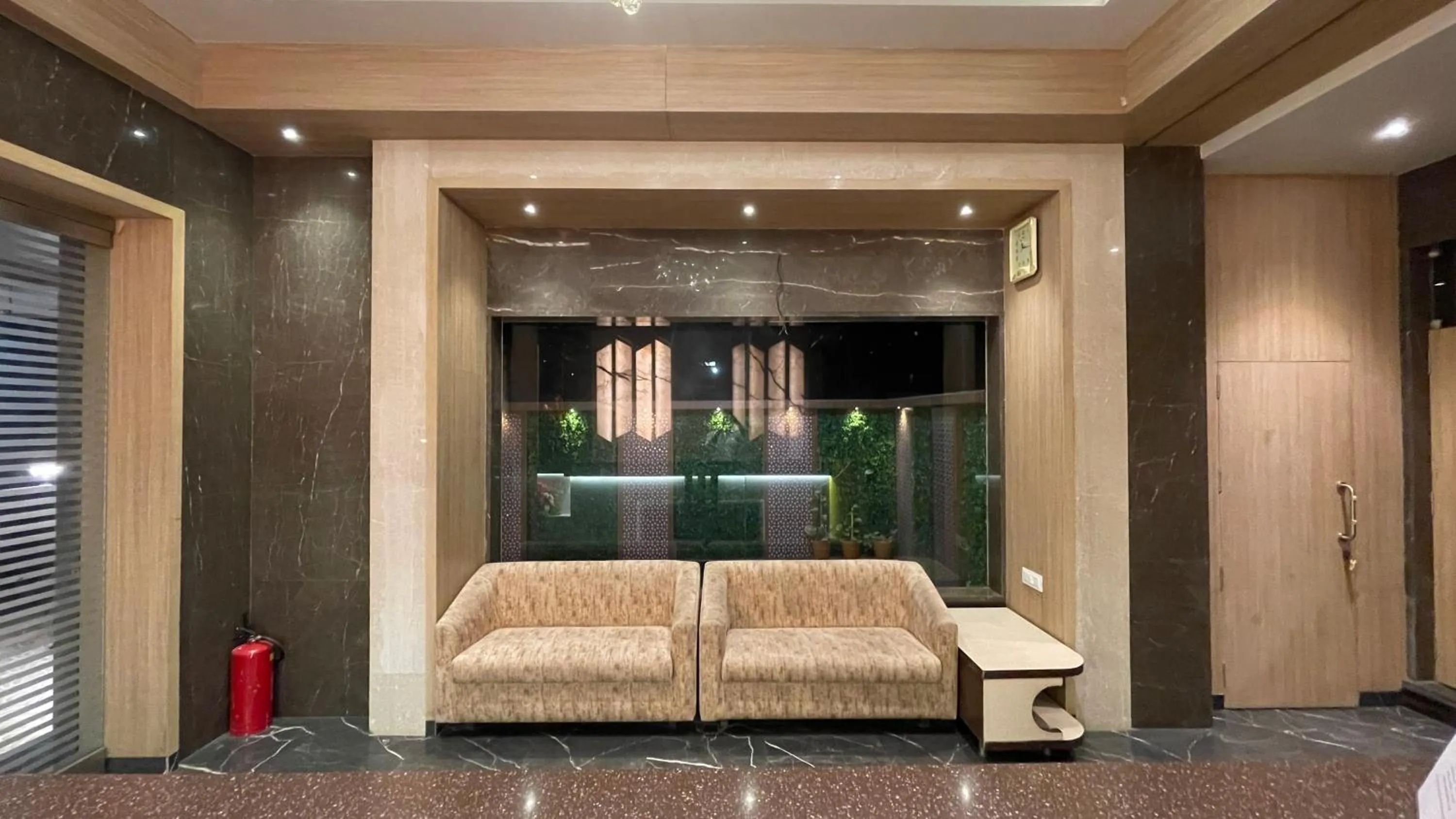 Seating area, Bed in Hotel Sarovar Residency