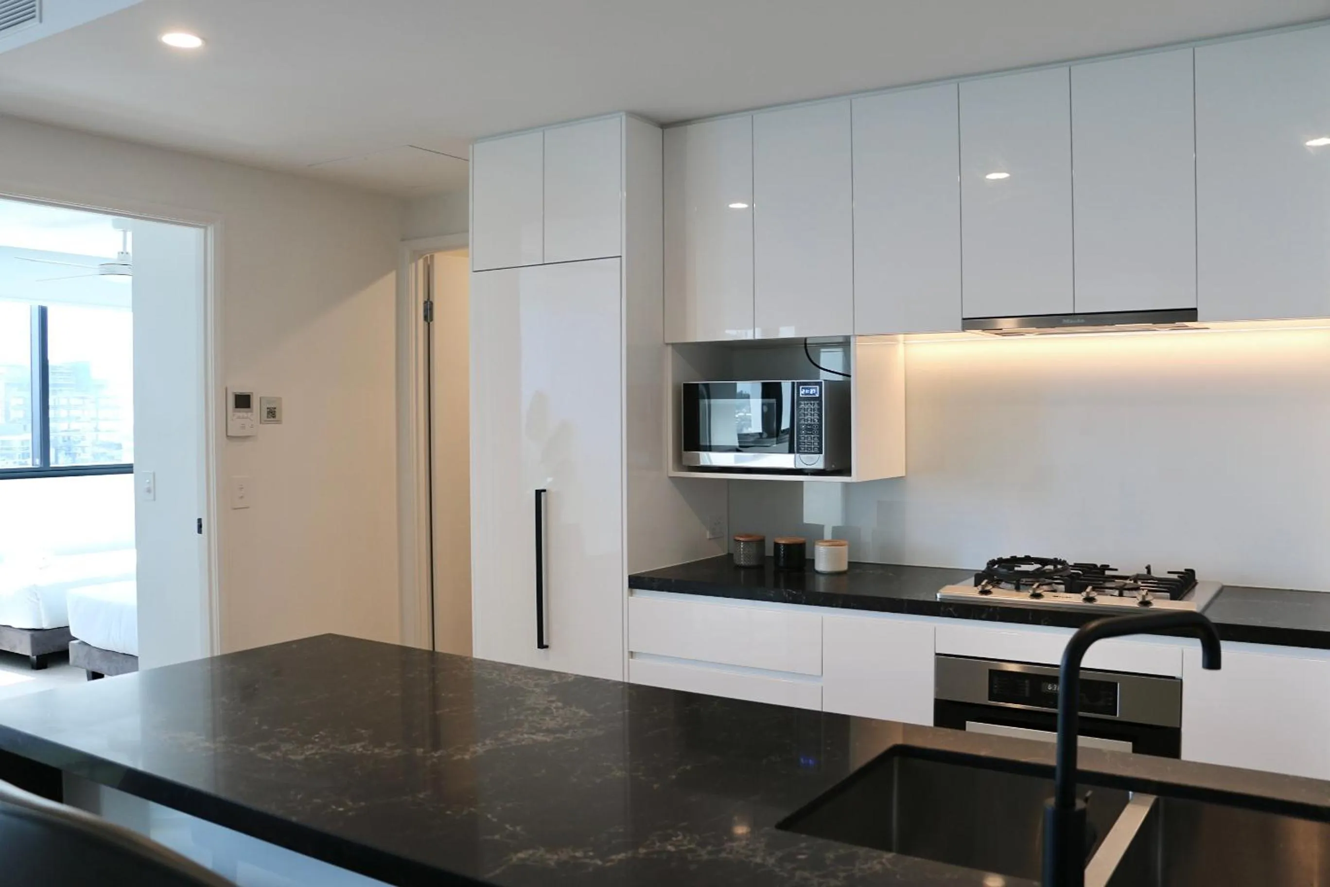 Kitchen or kitchenette in Kooii Apartments