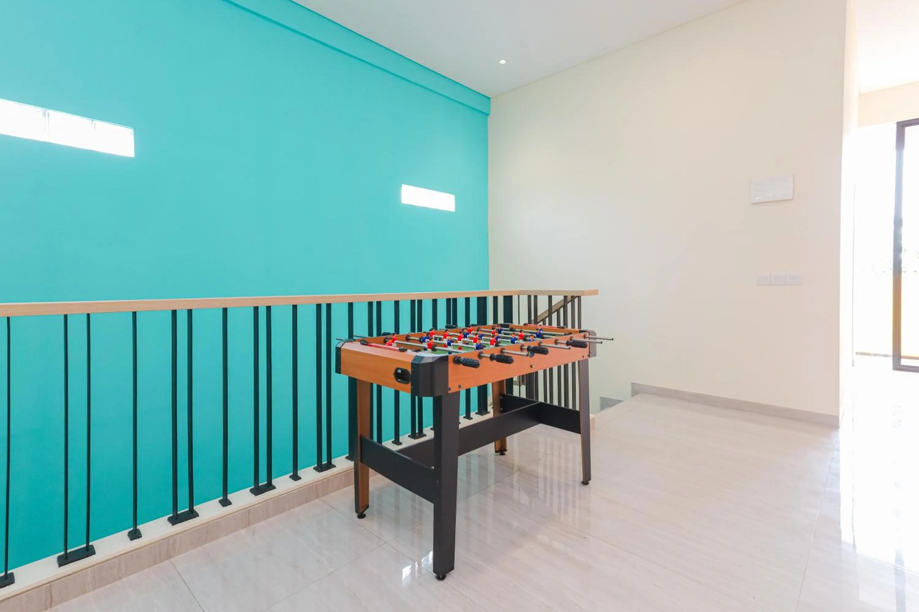 Game Room in Sans Hotel Clover Ace Surabaya by RedDoorz