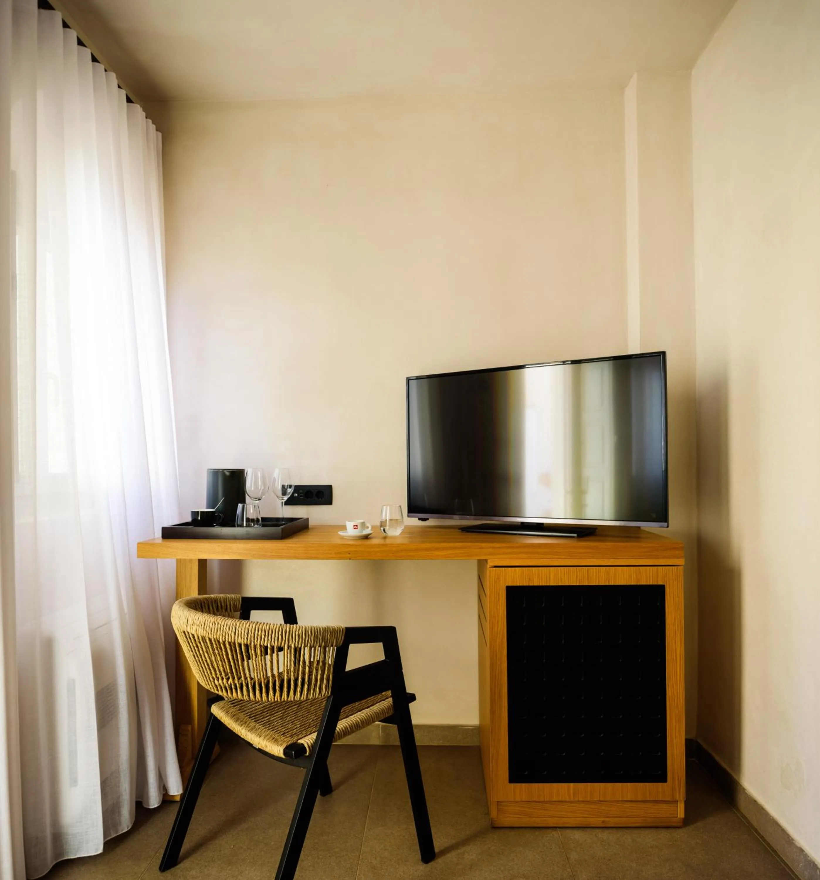 TV and multimedia in Andromeda Villas & Spa Resort