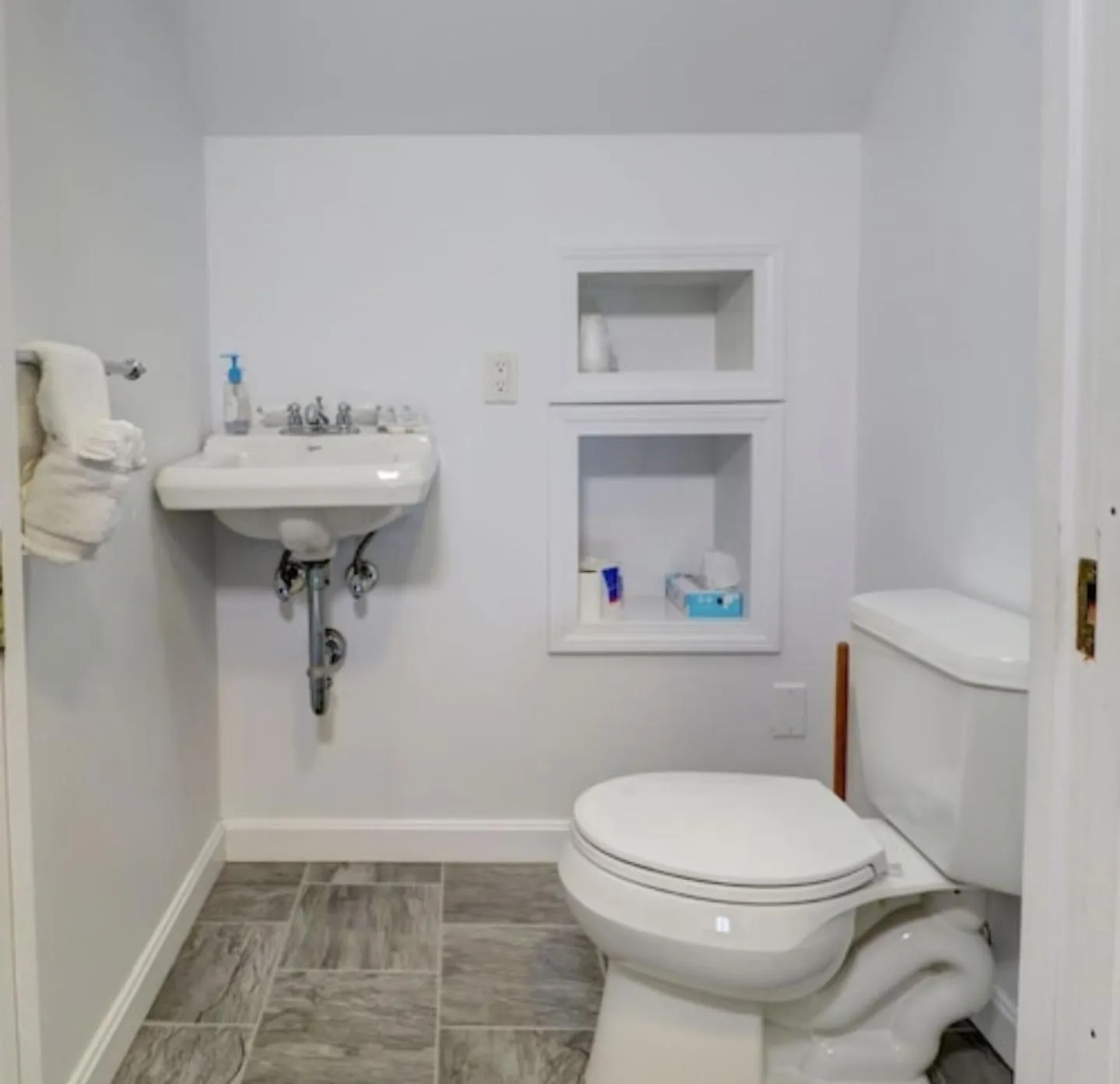 Toilet in Carriage House Motel Cottages & Suites