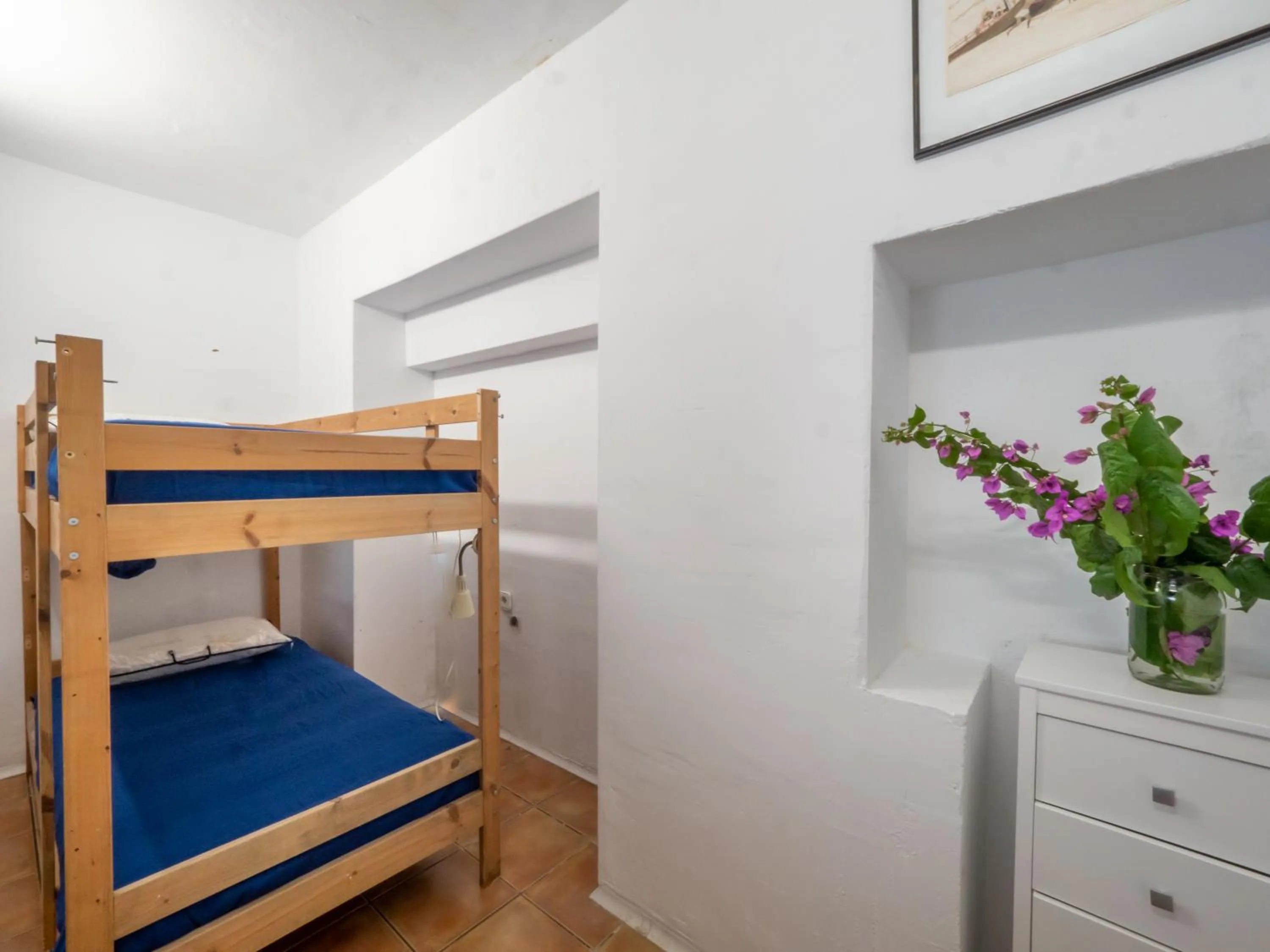 Bed in Flateli Sa Tuna Apartment