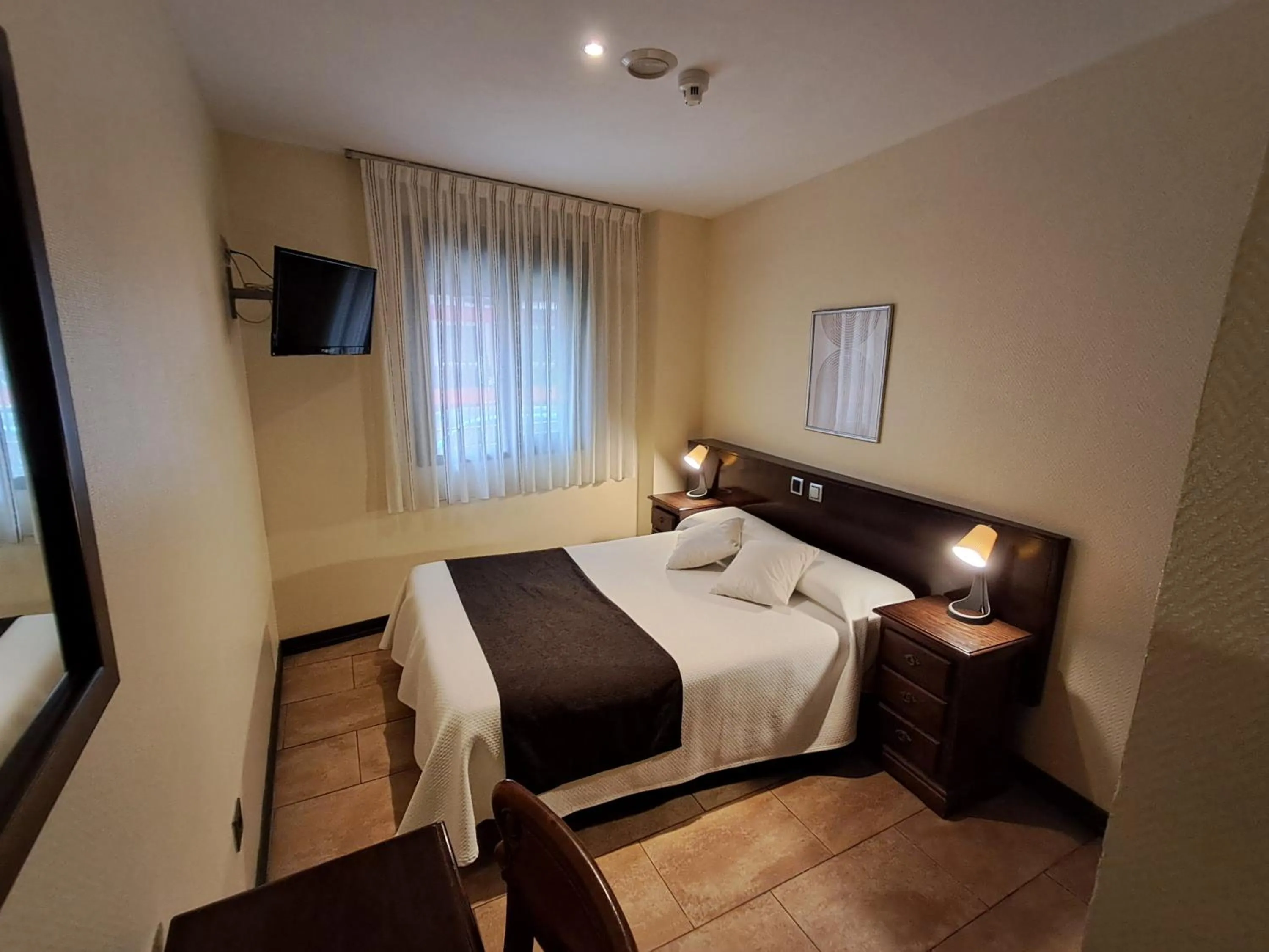 Bed in Hotel Complutense