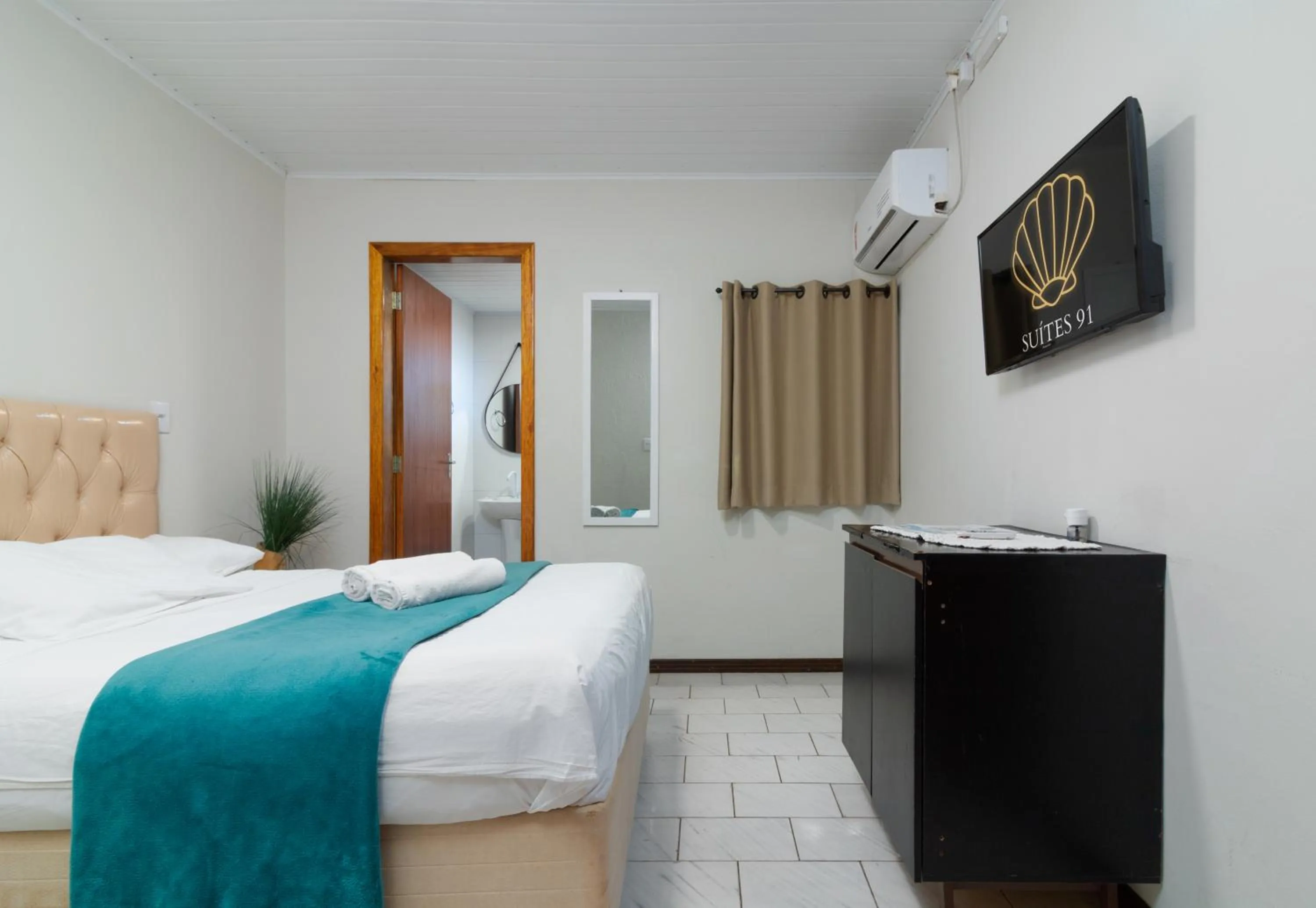 Communal lounge/ TV room, Bed in Suítes 91