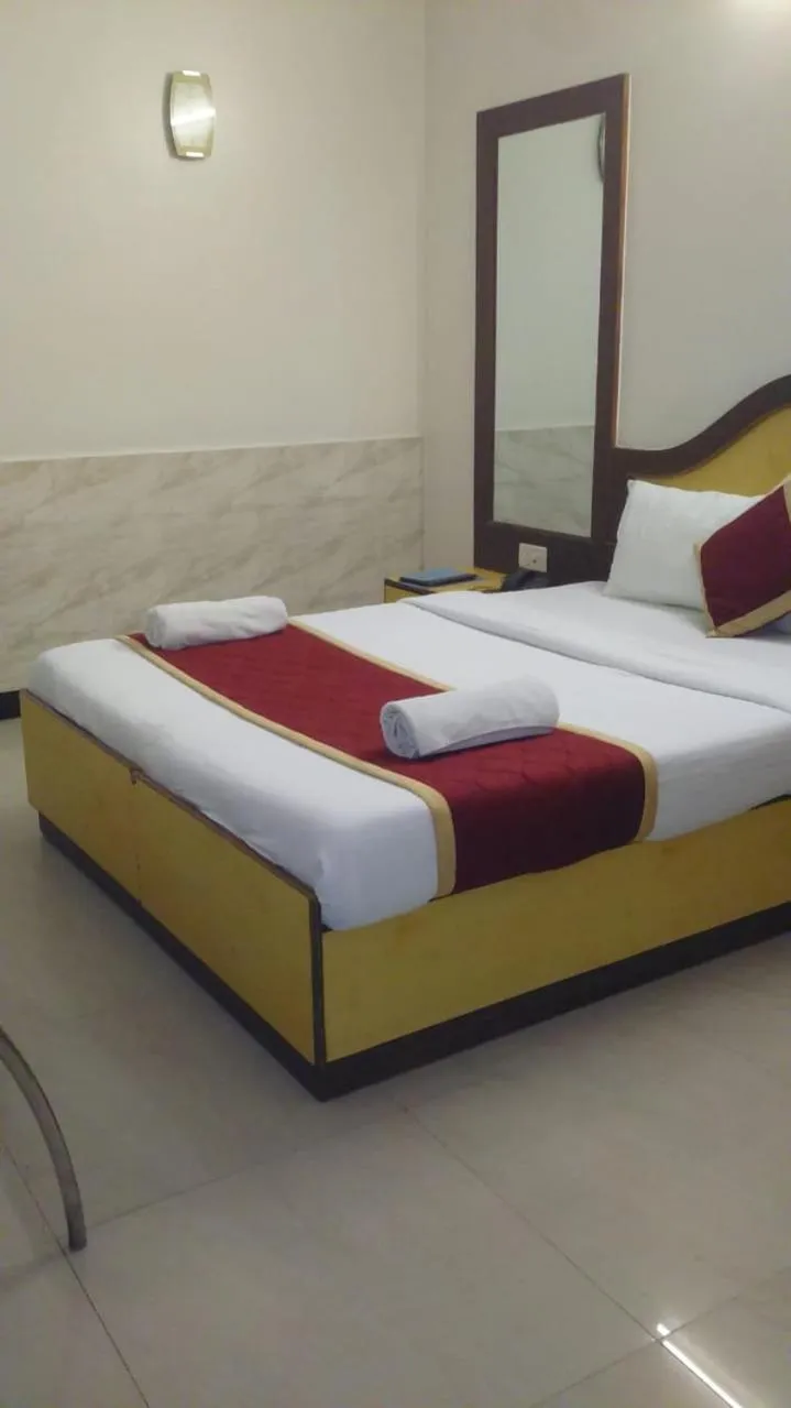 Photo of the whole room, Bed in Ganga Sagar Hotel