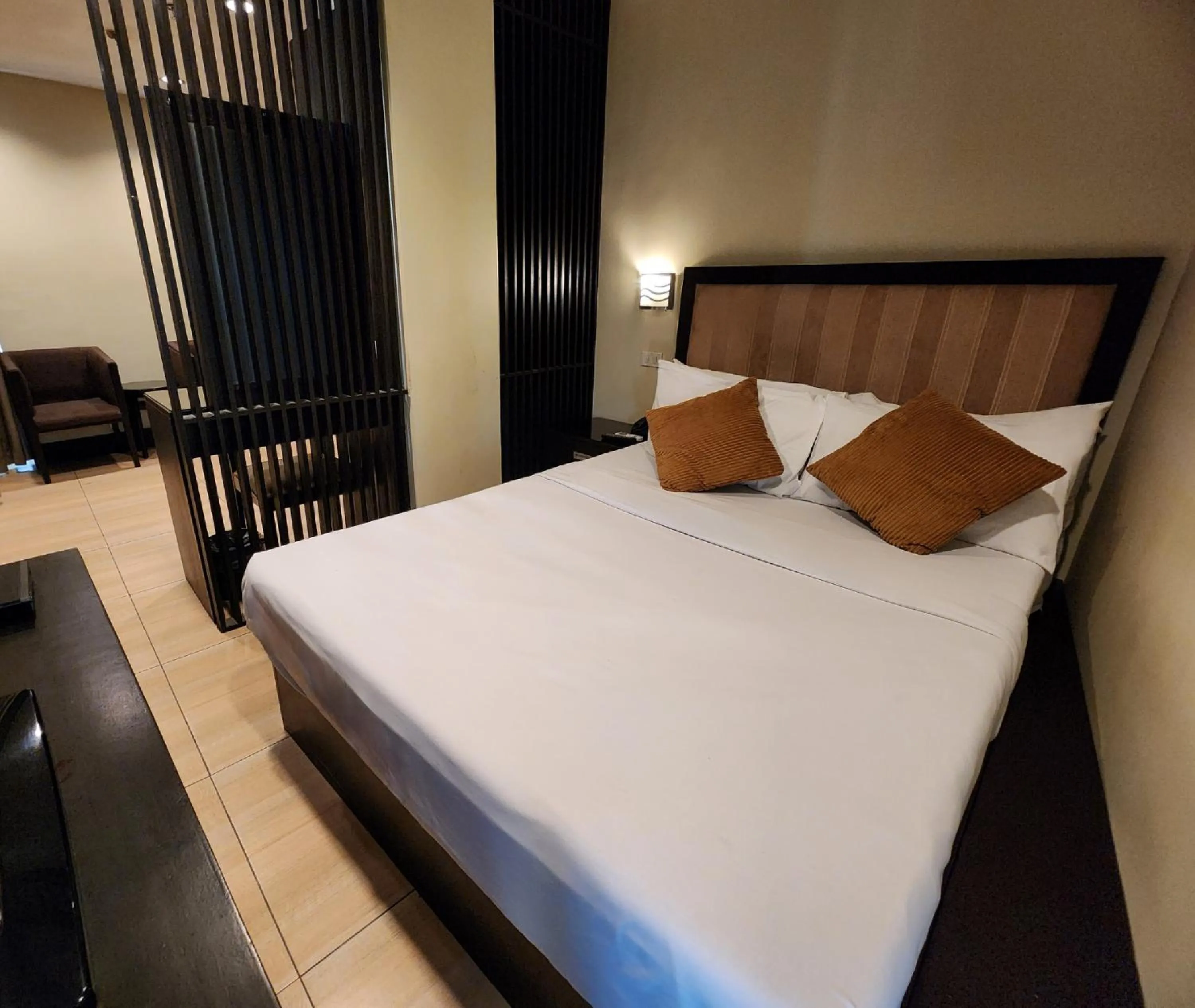 Bed in Green Glass Hotel