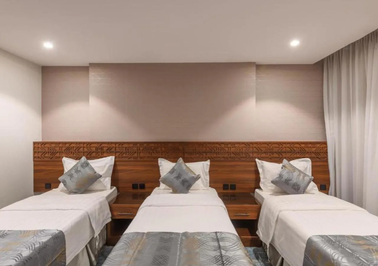 Bed in Manazel Al Zaireen Hotel