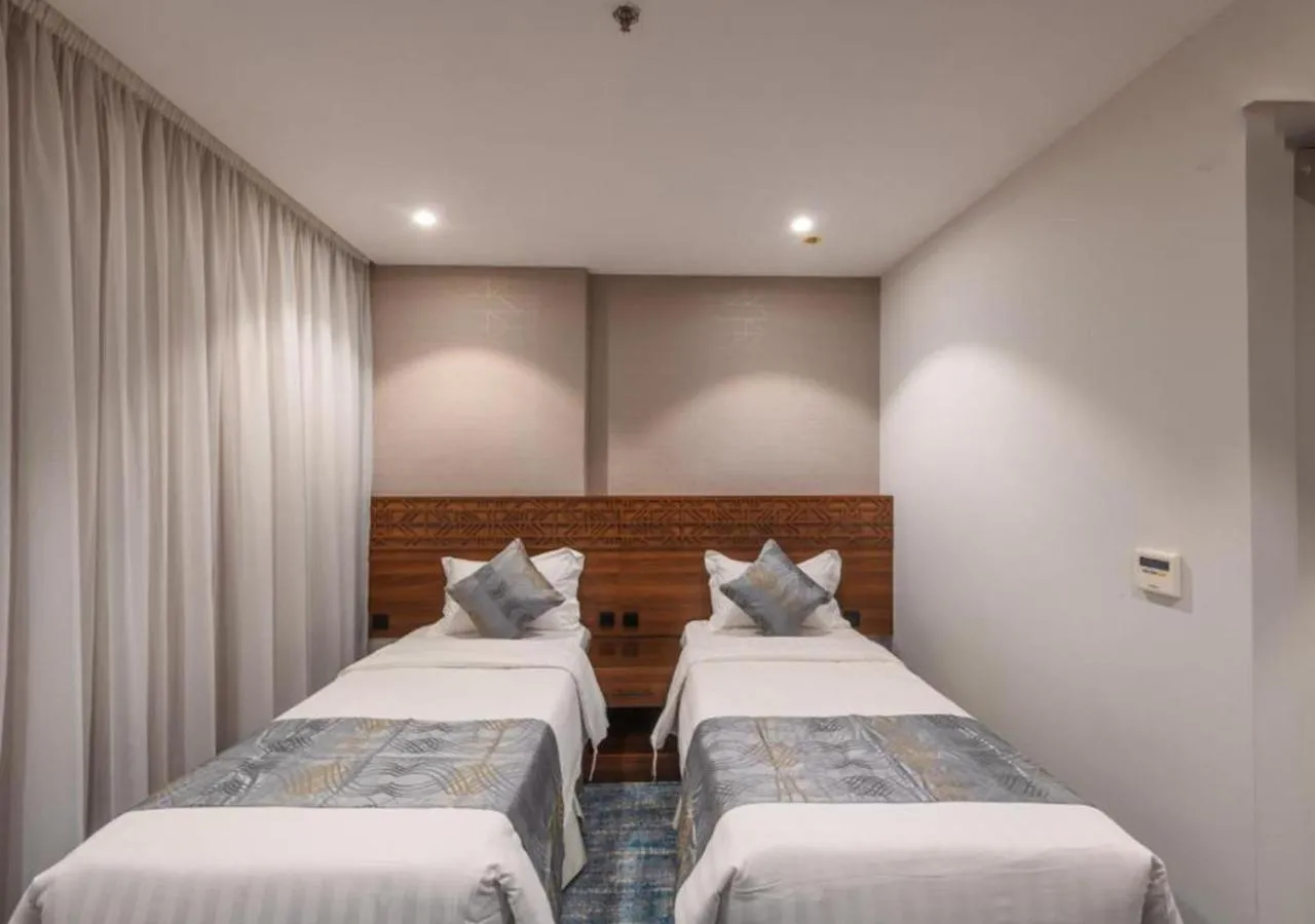 Bed in Manazel Al Zaireen Hotel