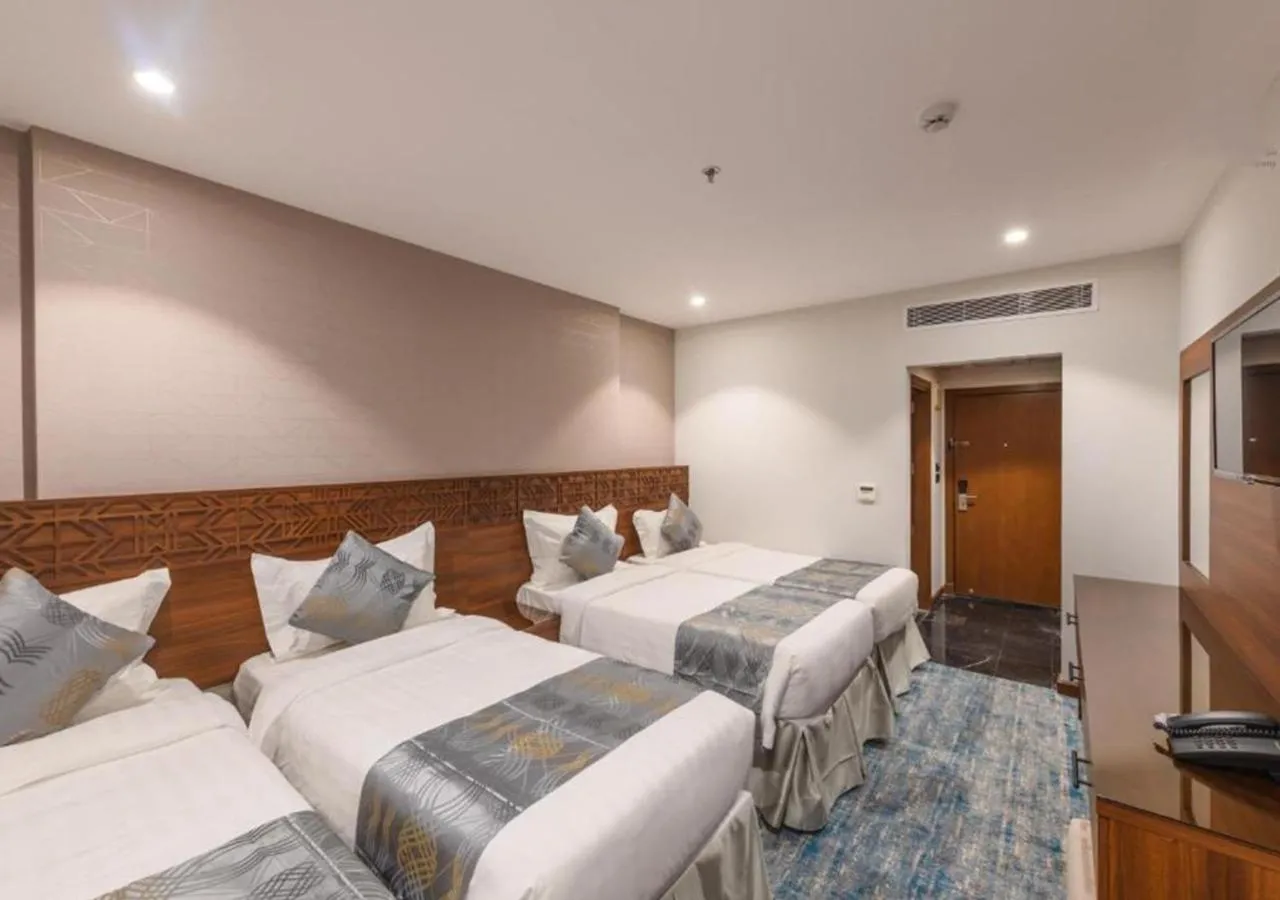 Bed in Manazel Al Zaireen Hotel