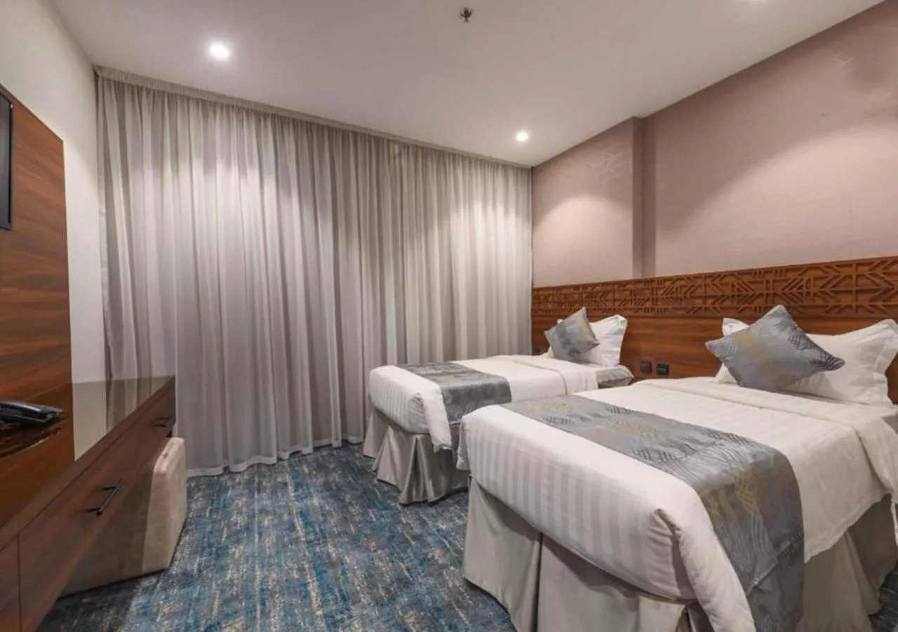 Bed in Manazel Al Zaireen Hotel