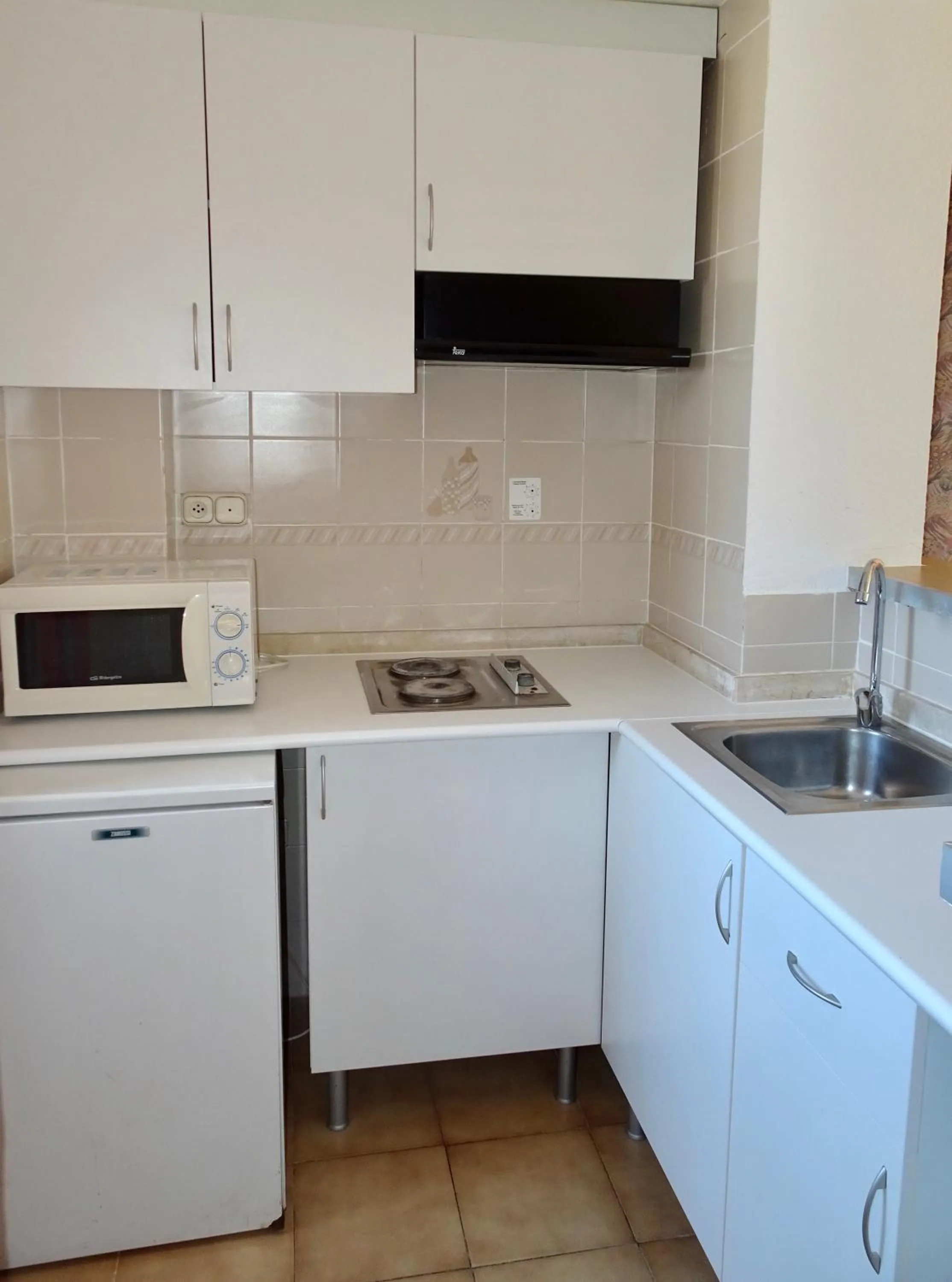 Kitchen or kitchenette in Evamar Apartments