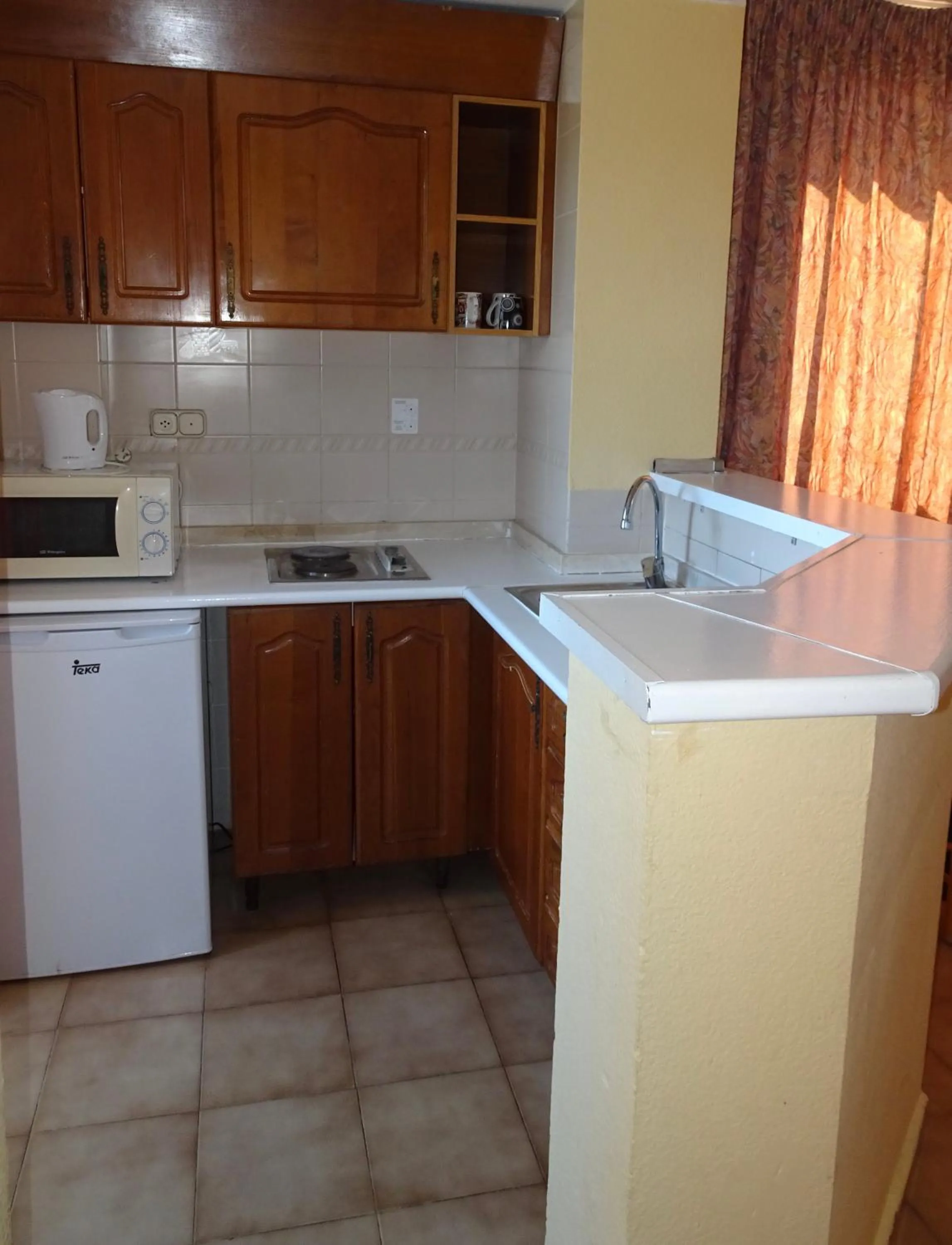 Kitchen or kitchenette in Evamar Apartments